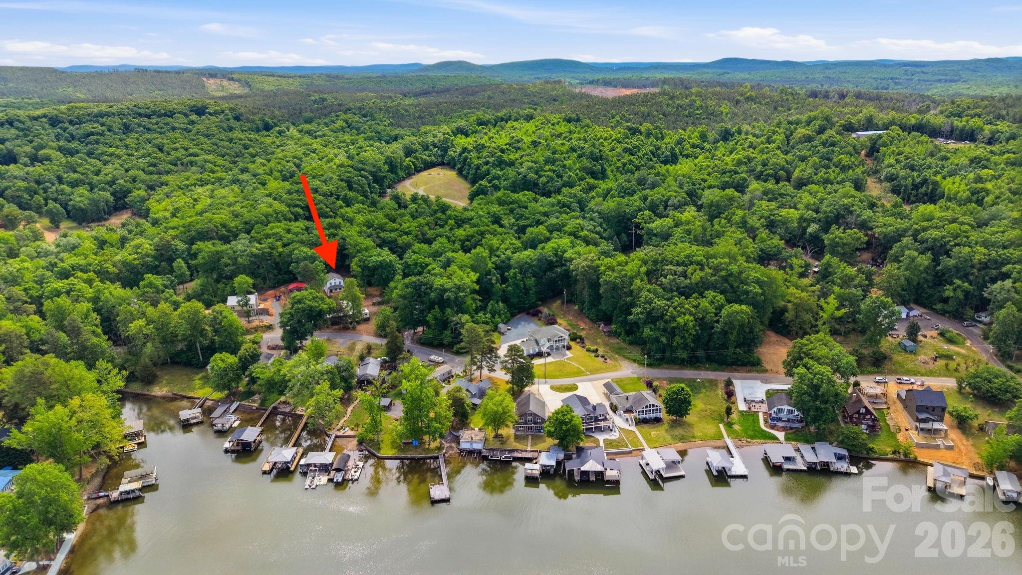 Beautiful new construction home with views of Badin Lake! This 3BR/2.5BA home features an open floor plan, a spacious kitchen with a large island, wood cabinetry, and detailed trim throughout. The primary suite includes a private ensuite bath and custom closet.
Relax or entertain on the inviting front porch while enjoying views. This is not a basic build—there are numerous upgrades throughout the home.
Located near the 5,350-acre Badin Lake and Uwharrie National Forest, offering boating, incredible wildlife, and endless outdoor adventure. Ideal for full-time living, a weekend retreat, or a vacation rental opportunity.
Conveniently located near Old North State Marina for fuel and Scallywags waterfront restaurant, known for great food and live music. Don’t miss the area’s popular Fourth of July lake celebration featuring the boat parade and fireworks.
Within one hour of Charlotte and the Triad. USDA eligible, offering a potential 100% financing option. No HOA.
Photos/virtual staging are from a similar build. Professional photos coming soon.
Circle Drive public boat ramp is located nearby for easy access to the lake for your boat and water toys. Get ready to enjoy summer on the lake!  Buyers are permitted a blue-tape for touch-up items.
