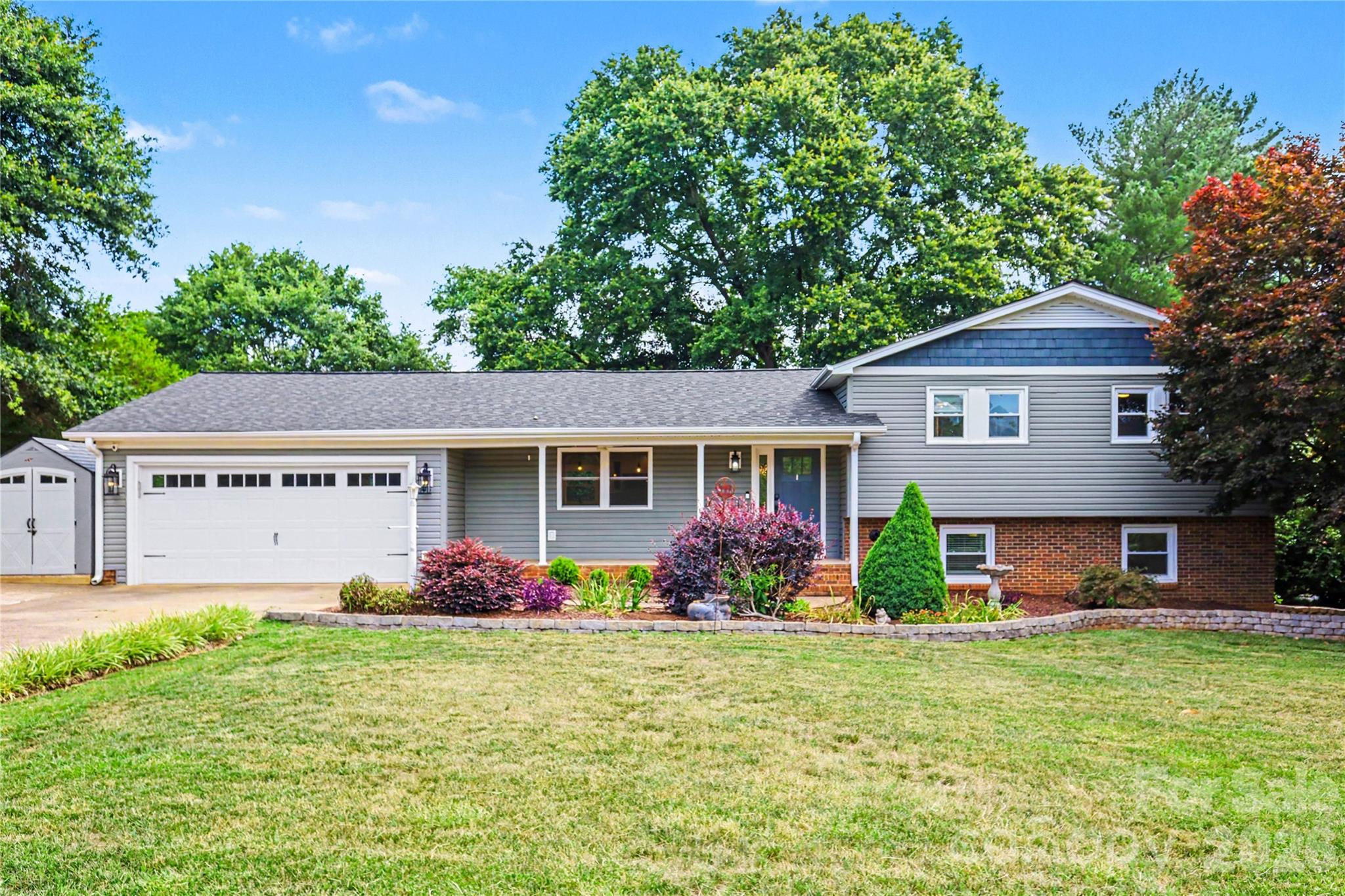 OPEN HOUSE TODAY--FRIDAY, JUNE 19 from 5-7 PM!!!  FABULOUS RENOVATION in this classic split-level home overlooking River Bend Golf Course - with views of a pond included - and ADDITIONAL partially finished OUTBUILDING! Complete remodel on the main level includes a custom kitchen and open floor plan family room/dining/kitchen. Sellers added square footage to make a convenient flex space with huge walk-in pantry, built-in drop zone with shelf, cubbies and hooks, AND a half bath. The original carport was enclosed to make a two car garage that doubles as additional entertaining or play space with finished walls, ceiling, and mini-split HVAC. The CHEF'S KITCHEN is HIGH END with so many custom details--black stainless steel appliances, separate beverage refrigerator, induction cooktop, custom vent hood, wall oven and microwave, under counter lighting, pendant and recessed lighting, electrical plugs w/ USB chargers, one touch sink faucet, and MORE! The family room has an electric fireplace w/ shiplap mantel. Upstairs, you will find 3 bedrooms and 2 baths. The primary bedroom has an ensuite bath, and there is a beautiful view out every window! The other two bedrooms share the renovated hall bathroom...don't miss the pull-out drawer/step stool beneath the sink. On the lower level, there is an additional den with French doors leading to a patio, gas log fireplace, bedroom, and large bathroom with heated floors! The washer and dryer hookups are in the bathroom. Outside, there is a huge deck with gazebo cover that includes remote controlled fans and heater AND a hard piped gas-fueled Blackstone griddle! ADDITIONAL OUTBUILDING with two rooms and rough plumbed bathroom. Sellers added wall HVAC and used one room as a completely finished home office. The other large room is unfinished but offers great storage (noted in additional square footage)! Main house -new electrical, new windows, new plumbing, new siding, new gutters -- all replaced in 2021 remodel.  ROOF 2025, tankless gas water heater, Nelon Cole termite and moisture bond w/ French drain and sump pump, and new security system.  Sellers are leaving the fountain in the back yard. Don't miss this RARE FIND--a completely updated home in the highly desirable Riverbend community!  NO HOA!