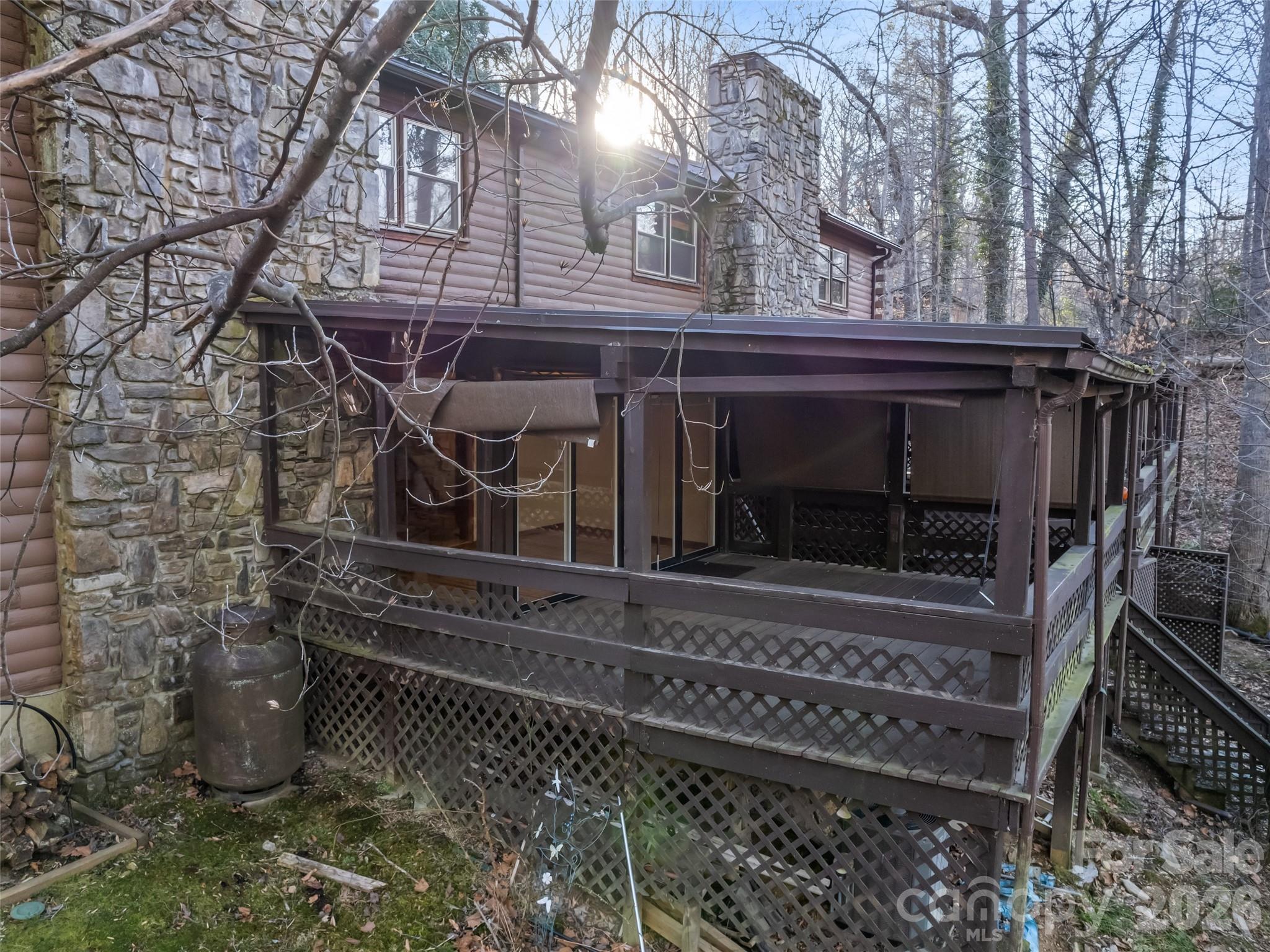 Price, location, and completed repairs make this Maggie Valley property worth another look. Enjoy mountain living without the steep roads or extensive upkeep often found in the area. This 2-bedroom, 1.5-bath home offers 1,118 sq. ft. of comfortable living space, a practical floor plan, covered porch, detached carport, and easy year-round access. Whether you're searching for a full-time residence, mountain getaway, or investment opportunity, you'll appreciate the convenience of being just minutes from downtown Maggie Valley, Waynesville, shopping, dining, golf, hiking, and the Blue Ridge Parkway. Offering easy access, manageable space, and recent repairs, this home is well-suited for year-round living or weekend escapes to the mountains.