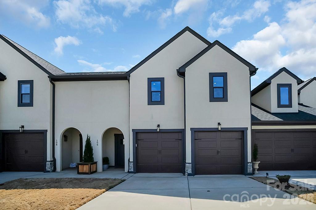 Welcome to Lincoln Country Club Villas, where this beautifully appointed 3BR, 2.5BA townhome, built in 2021, offers upscale golf course living with 3,190 sq ft of thoughtfully designed space. This impressive home features a 2-car garage, LVP flooring throughout, blinds, and an open-concept layout ideal for both everyday living and entertaining. The spacious kitchen is a standout with a custom oversized island, granite countertops, tile backsplash, under-cabinet lighting, soft-close cabinetry, new stainless steel appliances, and a custom pantry with built-in storage. The primary suite is a luxurious retreat with a walk-in closet with custom cabinetry, dual vanity, and a custom tiled shower with seamless glass. Upstairs offers a loft, office/flex room, massive bonus room, and 2 guest bedrooms with walk-in closets joined by a Jack & Jill bath with dual vanity and custom tiled shower. Step outside to enjoy luxurious outdoor living with a 500 sq ft hardscaped patio, partially covered by a custom wood pavilion. Optional golf membership offers access to country club amenities, all just minutes from downtown Lincolnton and Hwy 321 for easy access to Hickory, Gastonia, and Charlotte.