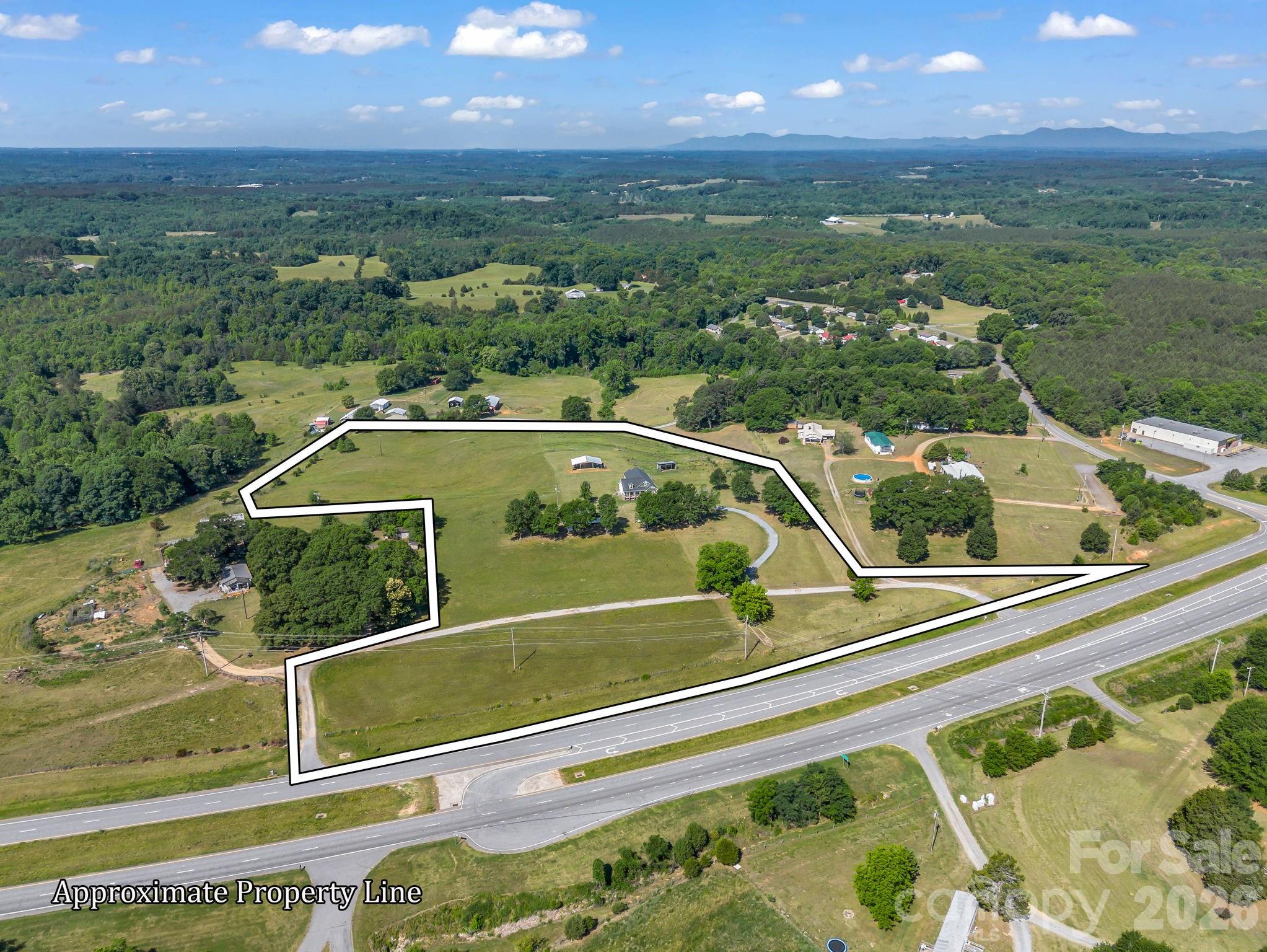 Bring your animals & dreams! Create the lifestyle you’ve always envisioned with this truly wonderful and hard to find home/land combination. The modern & spacious 3,135 sq.ft. 3BR/3BA home is well positioned on the 11.21 acre lot surrounded by rolling pastures. Perched on a hill far above the road maximizes privacy while delivering a peaceful setting with breathtaking sunrises at front of the home and glowing sunsets in the back. This setting also takes advantage of a mountain view and natural light at all times of the day, making every space feel bright & inviting. There is some fencing with a run-in enclosure. There is also a large multi-use covered area. The attractive & inviting home features a covered front porch, open floor plan, and fully finished upstairs. The spacious kitchen with center island with breakfast bar opens up into a large dining area. The primary bedroom features an ensuite bath complete with walk-in shower, relaxing garden tub, dual sinks, pocket door enclosing the toilet, and walk-in closet. Upstairs you will find an additional 1,100 square feet of versatile living space with a full bathroom to comfortably accommodate family, guests, or a self-contained home business. So many possibilities! There is a large rec/playroom with the remainder used as a fully functional recording studio with waiting room, and a dedicated refreshment area. Step outside to find a large storage shed and a dedicated pole with separate electric meter for a camper. Make this property your own private oasis with room to grow, create, and unwind! Please call for more details.