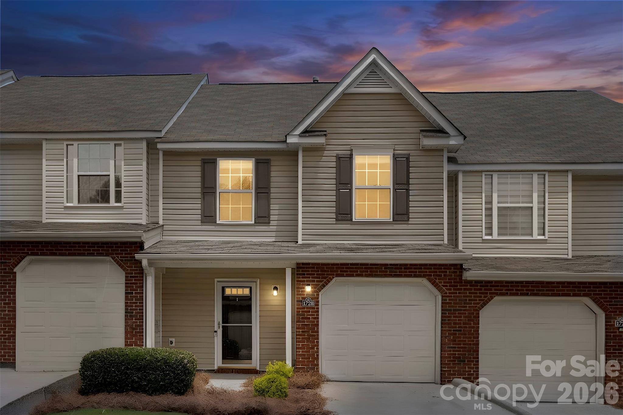 Tucked inside Lexington Commons, 1728 Eagle Ridge Drive offers the kind of easy, low-maintenance living that makes everyday life feel a little simpler. From the covered front porch to the attached garage, this two-story townhome is designed with comfort, function, and convenience in mind. Step inside to an open main-level layout where the living room, dining area, and kitchen all connect naturally, creating a space that works just as well for a quiet night in as it does for hosting guests. The kitchen features stainless steel appliances, a built-in microwave, ample cabinet and counter space, and a center island with an extended overhang for additional seating. Upstairs, the layout continues to make sense with two spacious bedrooms, each offering its own private en-suite bath. Vaulted ceilings, ceiling fans, large closets, and oversized windows give both rooms a bright, comfortable feel with plenty of natural light. The attached garage adds convenient parking and extra storage, while the Lexington Commons location keeps you close to I-77, shopping, dining, and all that Rock Hill has to offer. Whether you are looking for a primary residence, a low-maintenance lifestyle, or a well-located home in Rock Hill, this townhome is one you will want to see.
