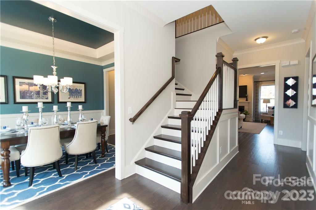 A 5 bedroom former model home in Tega Cay! Main floor features a guest bedroom with full bath, an extra half bath for guests, french door study with custom built ins, formal dining room, kitchen (with HUGE island, SS appliances, granite counters, gas stove, wall oven) opening up to the breakfast nook & family room with a gas fireplace. Upstairs has a bonus room with more custom built ins, 3 more guest rooms with two more full bathrooms, laundry room for convenience. The upstairs primary bedroom has sitting area,  walk in closet, en suite bath with dual sinks, make up vanity, walk in shower and separate garden tub. Backyard has nice size patio as well as built in fire pit. 
Resort style amenities include clubhouse, fitness center, basketball courts, tennis courts, walking trails, pool w/slide and a extra splash pool, playground. Available for immediate move in!