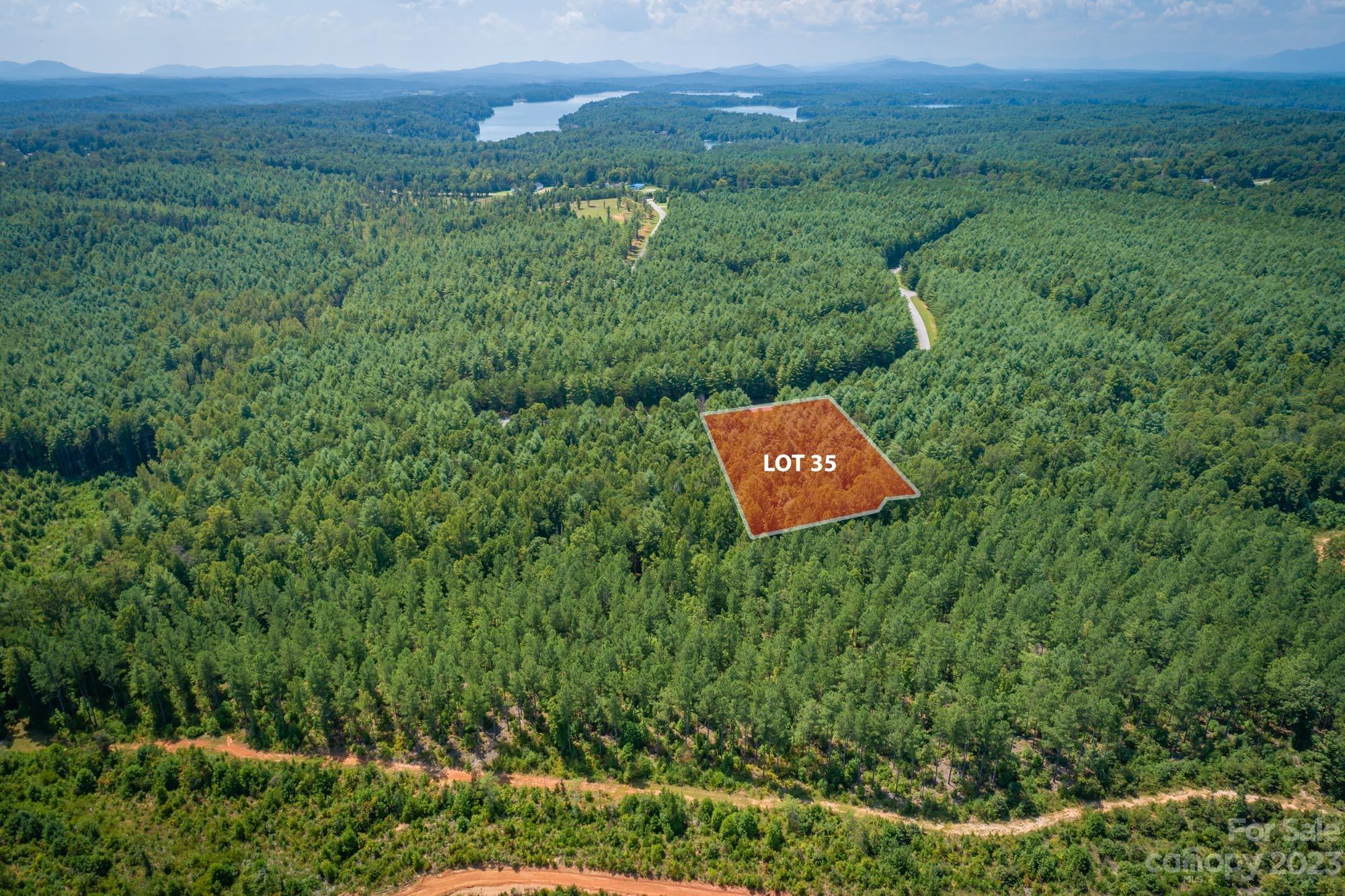Come see this great wooded homesite in Hawksbill at Lake James, a gated community near beautiful Lake James. Hawksbill offers wooded seclusion and level, easy-to-build lots with gentle paved roads and underground utilities including city water. Only 2 miles from Linville Boat Ramp - an easy & convenient spot to launch your kayak or boat onto Lake James, a 6500 acre lake with over 150 miles of shoreline and incredible views of the Blue Ridge Mountains! Mimosa Landing Marina is only 5 miles away. Only 10 miles from downtown Morganton, a charming small town with great dining, shopping and entertainment, several craft breweries and locally-owned shops. Less than an hour to Asheville and 90 minutes to Charlotte. This homesite offers a great value this close to the lake with the protection of a small gated community.