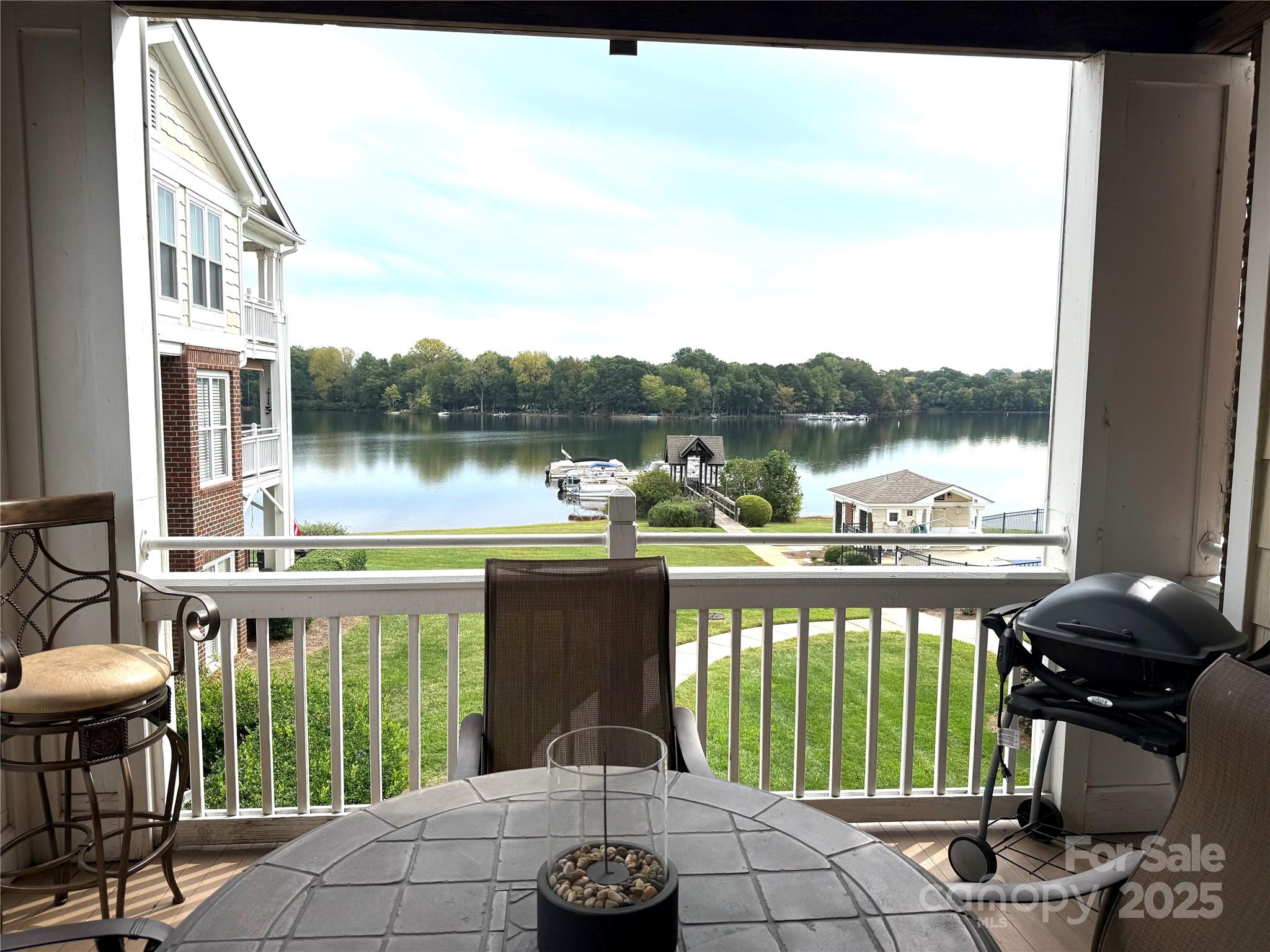 Enjoy lake living in this Spinnaker Point end unit condo on Lake Davidson, complete with a boat slip.  Million Dollar views can be seen from every  window!  Plantation shutters and new LVP throughout most of the condo.  The open floor plan has a fireplace, built-ins and a kitchen bar area.  The primary bedroom has deck access and a custom walk in closet.  There is additional storage room just outside the condo.  The community offers lake access, kayak and paddle board launch, swimming pool and tennis courts. 
Condo is Unit #20, on second floor of Building 2.
Deeded boat slip included.   Some furniture is staying - in the process of marking what will remain.