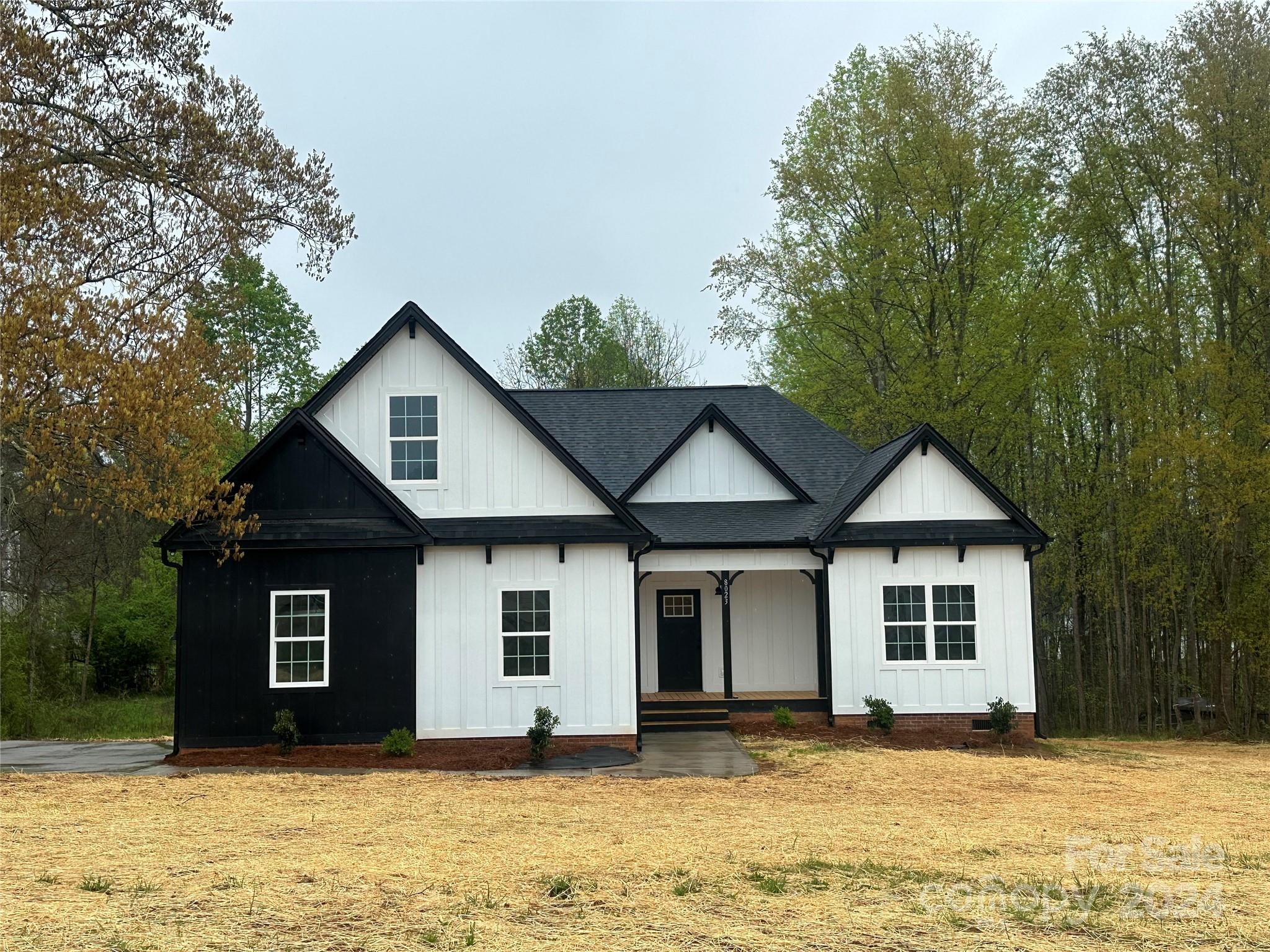 Welcome home to 8023 Smooth Stone Court located in Sanders Landing, one of Clovers SC beautiful countryside developments!  Under construction this farmhouse style build is almost ready for its new owner!  From the outside accents throughout the interior there is not another one like this! Luxury vinyl plank floors, craftsman style trim, custom cabinetry, open floor plan and so much more! Primary bedroom plus 2 more bedrooms downstairs and a bonus room upstairs! Enjoy the private 1 acre lot from your front porch or your covered back deck! Hurry you won’t want to miss this one!