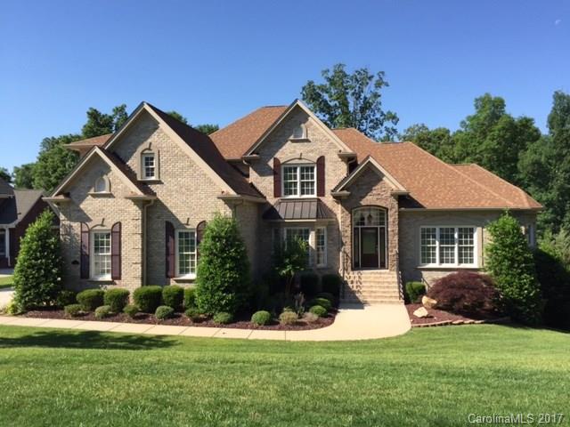 MOVE IN READY at a New Lower Price!! Like new, stunning custom home perfect for in-law/blended family;Home has exceptional amt of natural light, 2 Story Great Rm w/ FP & builtins;ALL new paint & new upgraded carpet; 2 decks, one screened in; Walk out basement has own entrance, FP and full bath;3 HVAC units to heat/cool each level independently;Many rooms/deck/garage wired for speakers:Landscaped garden & terraced hardscape for veg garden. Check out virtual tour for more photos!