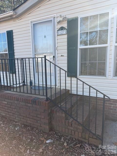 Seller Motivated !!Country Living on almost half acre --No City taxes- 
Great Mooresville Schools
Spacious Mobile Home in Ashley Woods --Recently Updated with Laminate Wood Flooring 
throughout Open Great Room -DR & Kitchen w/ Island - Separate Laundry Room has Laundry Sink
Plus Water Softener Included !!
Split floor plan with Master Bedroom & nice size two other bedrooms 
Mas Bath has a jacuzzi tub/Separate shower -Double bowl  vanity -Master walk-in Closet
Backyard has a Nice White Wooden deck for Grilling & enjoying a large flat back yard -
Outside Storage Shed 
Appliances included stated per MLS electric range-dishwasher--
"Refrigerator is Negotiable with Acceptable offer"
 Minutes from historical downtown Mooresville --Close to Shopping-& Freeways!
