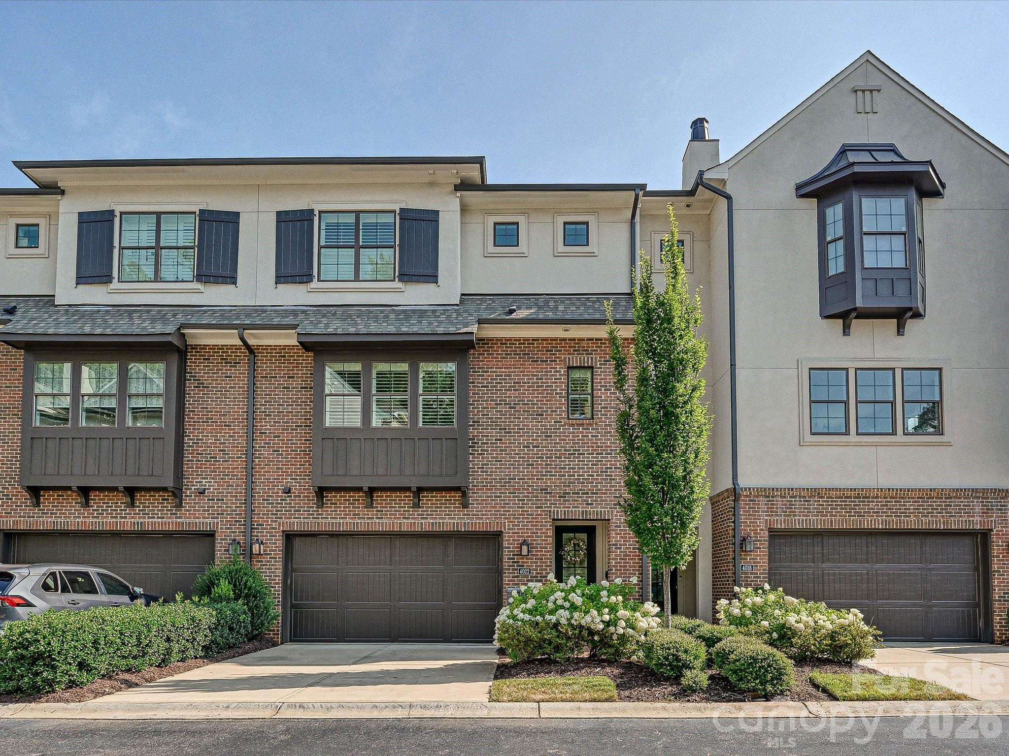 Luxury townhome in the heart of SouthPark! Built by Simonini, this three-story home offers an open, versatile layout ideal for everyday living and entertaining. Beautiful hardwood floors, neutral tones, built-in speakers & plantation shutters flow throughout. The main level boasts a spacious kitchen with 42” cabinets, a large island, stainless steel appliances including a gas range, and abundant storage—all open to the inviting living and dining areas. Upstairs, the primary suite features an ensuite with a garden tub, walk-in shower, and dual walk-in closets. A second suite also offers an ensuite bath and two walk-in closets. The lower level includes a large bonus room (or optional bedroom) with access to a full bath and entry from the foyer or garage. Minutes to shopping, dining, and entertainment, with easy access to the airport, highways, and greenway