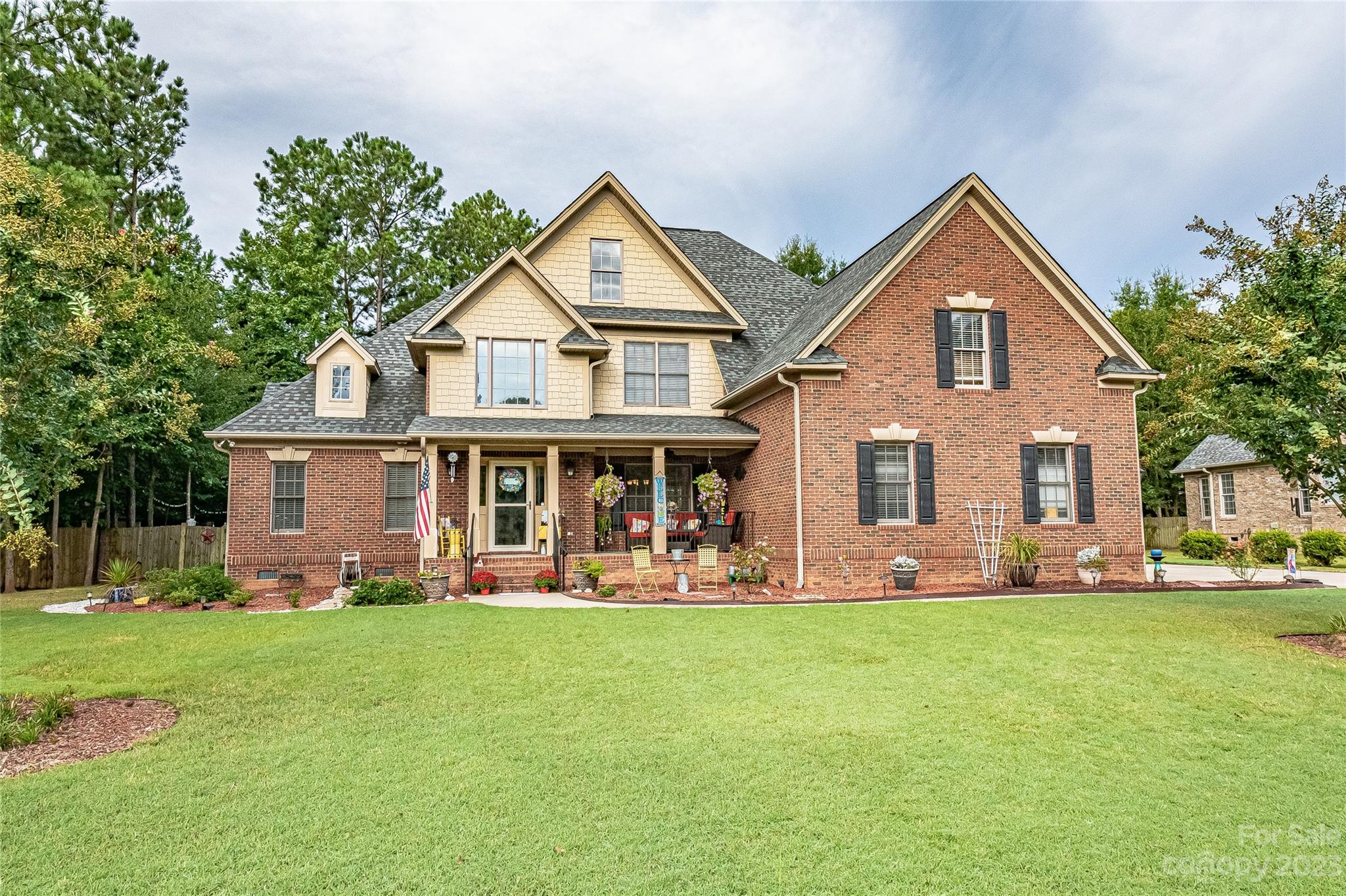 Stunning brick classic with 3 car garage and in-ground salt water pool in lovely Fairlawn neighborhood. Welcoming front porch with outdoor sitting area. 4 bedrooms/4.5 baths. Open floorplan with dramatic 2 story foyer & 2 story Great Room with fireplace. Large Formal Dining. Chef's Kitchen with gas & granite, stainless, raised, eat at bar, and breakfast nook. Owners Retreat with luxury bath and generous walk in closet AND Guest Room with built ins and full bath on opposite side on Main. Laundry down with sink. Two large secondary bedrooms up with Jack & Jill Bath, & a massive Bonus Room with private bath that could be 5th Bedroom with its own den.  Walk in Attic Storage. Backyard paradise that's perfect for entertaining or staycations. Storage shed for pool toys. Deck and patio. Fire pit. Fenced. Pool is only 4 years old. Oversized driveway for extra cars. Beautifully landscaped. Convenient to schools, shopping, dining, I-77, Winthrop & Piedmont Medical Center.
