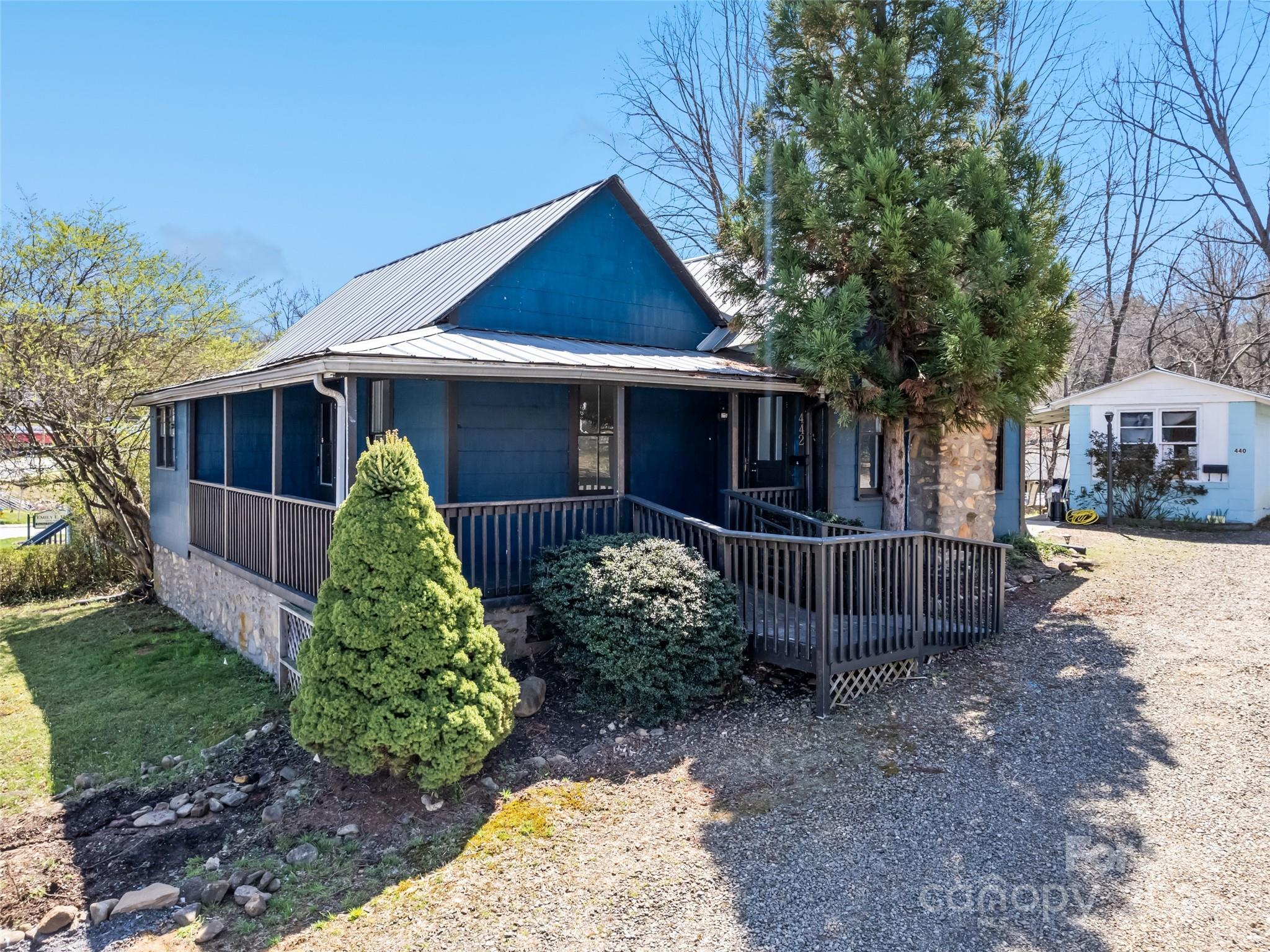 Prime opportunity in the heart of Waynesville! This charming 1920s farmhouse on Walnut Street offers endless potential with its mix-use zoning, perfect for both residential and commercial ventures. Situated in a bustling area of town, this property benefits from recent infrastructure upgrades, ensuring modern convenience while retaining its historic charm. The metal roof adds durability, and the 120'x50' parking lot provides ease for customers or tenants. Previously an acupuncture studio and most recently a long-term rental, this property is ready for its next chapter—whether as a cozy home, thriving business, or both. The accessory building further enhances its versatility, making it an ideal spot for a studio, project space, or rental unit. Don’t miss out on this unique opportunity to own a piece of Waynesville’s vibrant community, and call today for your private showing!