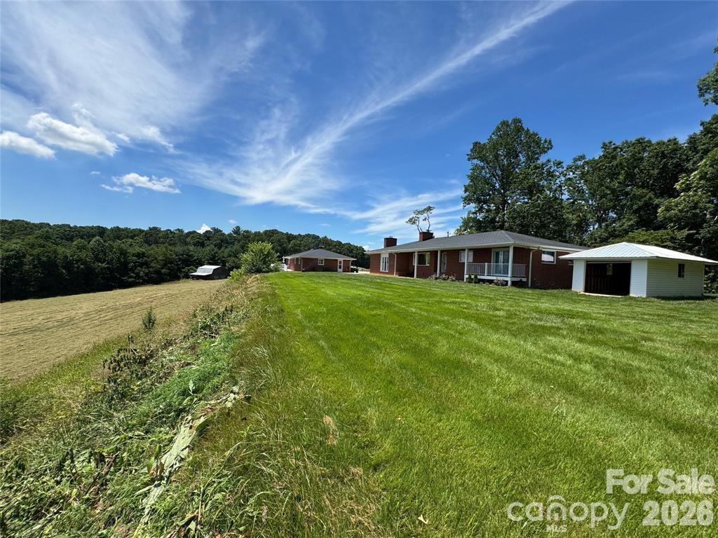 Horse farm? Family compound? Wedding venue? The possibilities are endless at this spectacular Mills River estate! Offering unmatched views, a premier location, and an array of features, this unique property is a rare investment or lifestyle opportunity. Ideally situated just minutes from Sierra Nevada, Asheville Regional Airport, the WNC Agricultural Center, and the vibrant shopping and dining scenes of both Asheville and Hendersonville. This extraordinary property includes two residences, a barn, spa-inspired bathrooms, serene riverside fire pit and gathering areas, and hundreds of feet of river frontage. Whether you’re looking for a private retreat, income-producing property, or a venue for events—this one truly has it all.••Highlights•• Mountain and water views • Zoning can be reverted to MR-LI (Light Industrial) • Close proximity to Asheville Regional Airport
