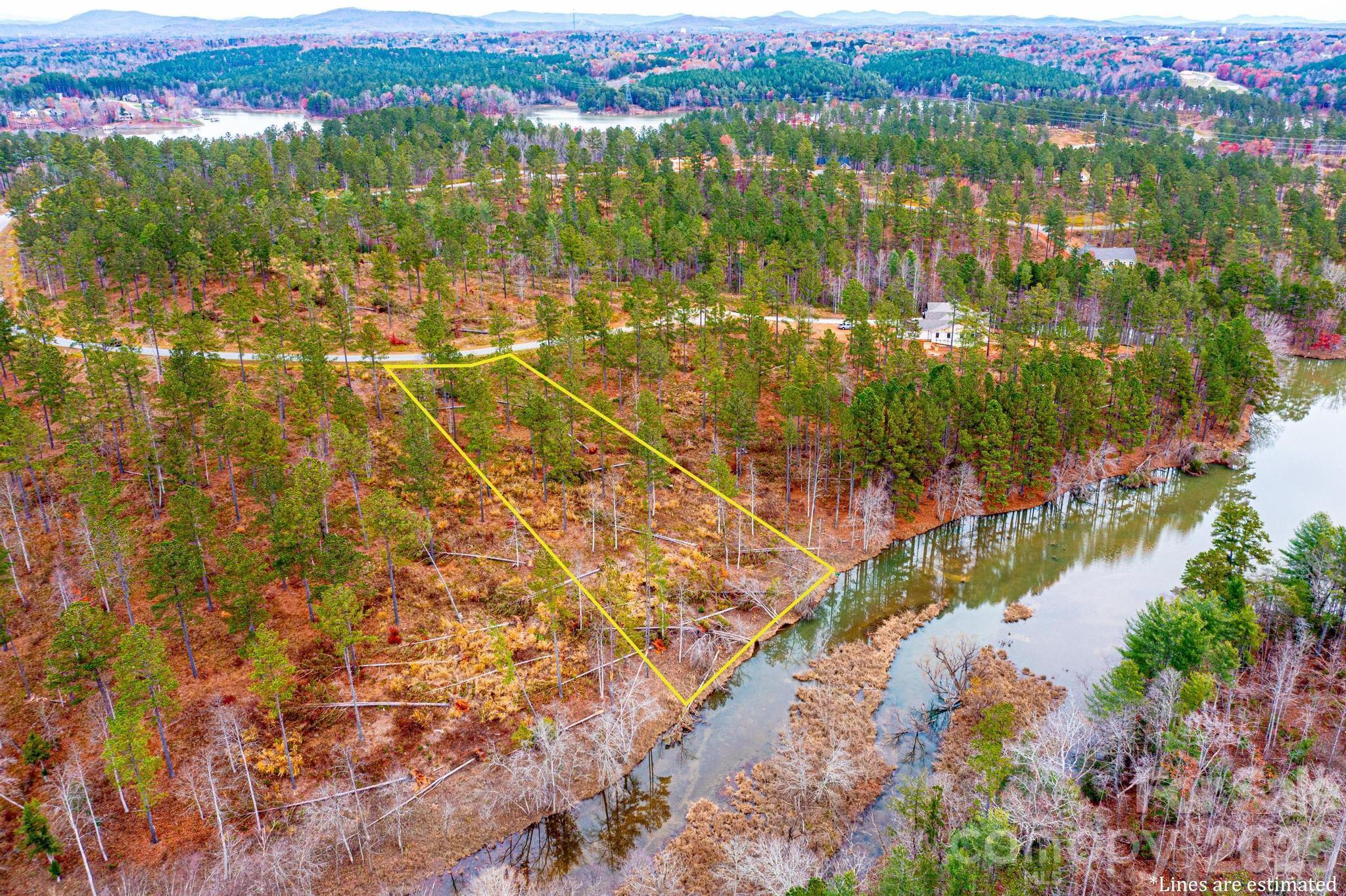 Build your dream home on this stunning peaceful cove lot in the highly desirable Lakeside Reserve community. Boasting approximately 183 feet of shoreline along a cove on Lake Rhodhiss, this homesite offers a gentle slope to the water—perfect for enjoying the beauty and convenience of true lakefront living. Experience the ideal blend of privacy and recreation. Lakeside Reserve features resort-style amenities, including a lakeside pavilion with pool, pickleball courts, scenic walking trails, a cookout and picnic area, a dedicated kayak launch with an outdoor grilling space, and secure storage for boats, kayaks, and RVs. Surrounded by nature yet just minutes from everyday conveniences, this property presents an exceptional opportunity to create your own lakeside sanctuary. Don’t miss your chance to be part of this picturesque waterfront community.