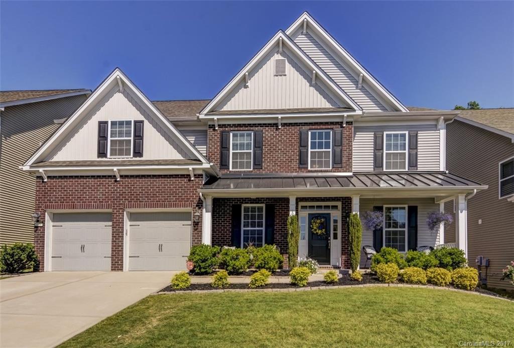 YOUR DREAM HOME AWAITS! Pottery Barn inspired home is decorated beautifully and is perfect for entertaining and casual living. Outdoor living space includes built in grill and pizza oven with wooded backyard. Hardwoods throughout the main level with guest suite. Large open concept kitchen with double ovens. 6 large bedrooms (or 5 + bonus) with 4 full baths. Front sitting room could also be a formal dining room, if desired. Close to pool, playground and common areas. Show and sell!