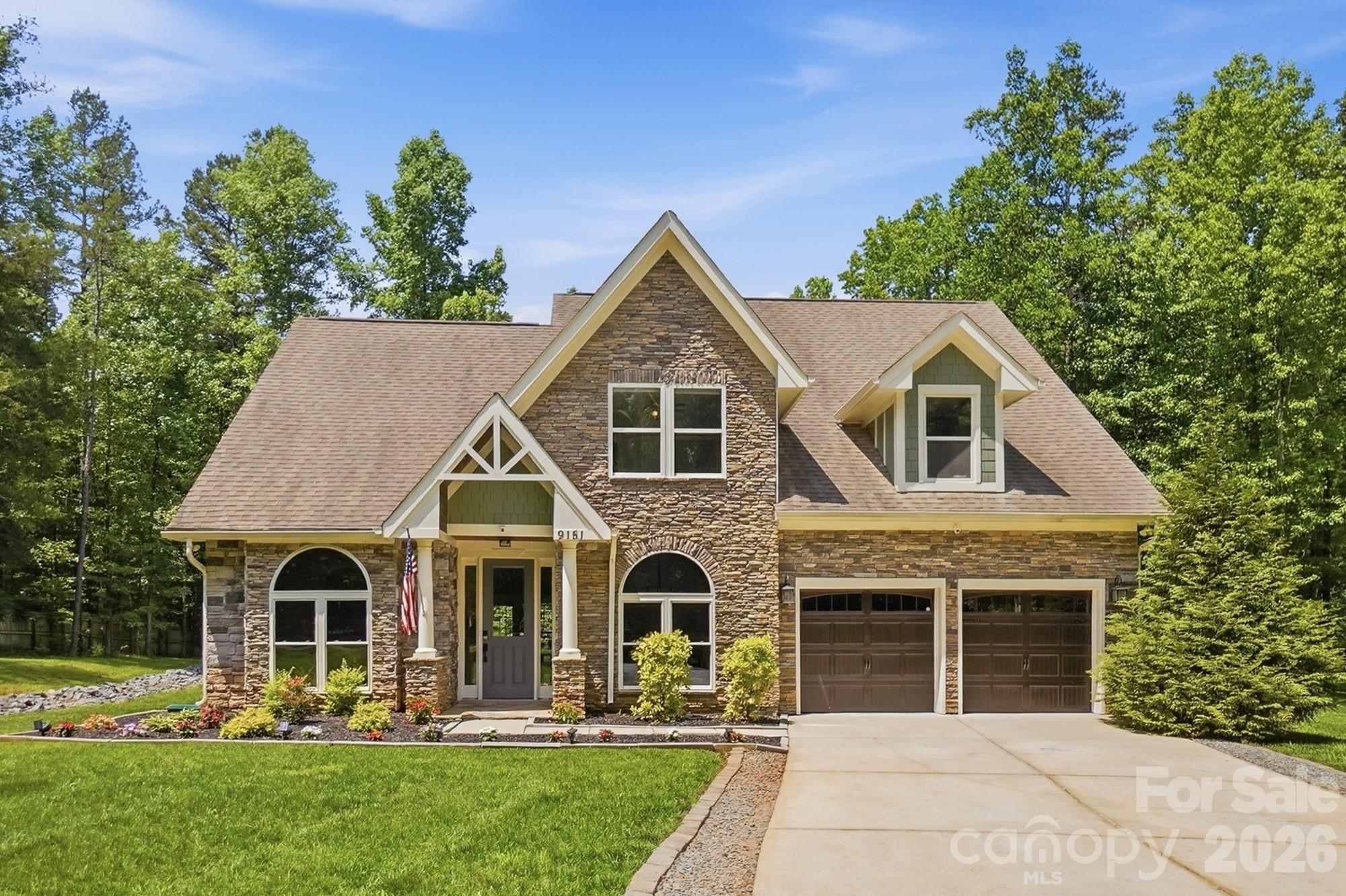 Tucked away on over FIVE PRIVATE ACRES, this stunning home offers the perfect blend of seclusion and convenience. Step inside to find an open-concept floor plan with a foyer that opens to the formal dining room and office, and a spacious great room with fireplace and soaring vaulted ceilings that extend to the second floor, creating a bright and airy atmosphere. The great room opens to a well appointed kitchen featuring granite counters, stainless appliances and a breakfast bar. The primary suite is conveniently located on the main level, offering privacy along with an en suite bath and a large walk-in closet. Upstairs, you’ll find two additional bedrooms plus a versatile bonus room that can easily serve as a fourth bedroom, home office, or media space. This flexible room also includes two generous closets for added storage.  A three car tandem garage and  shed offers plenty of extra storage space. Set back on a private driveway, the property offers exceptional privacy and natural beauty with a walking trail that leads to the creek that runs through the property. Whether you’re seeking space, privacy, or a connection to nature, this unique property has it all. Great location minutes to downtown Mint Hill where you can enjoy walking to outdoor dining spots & farmers market.