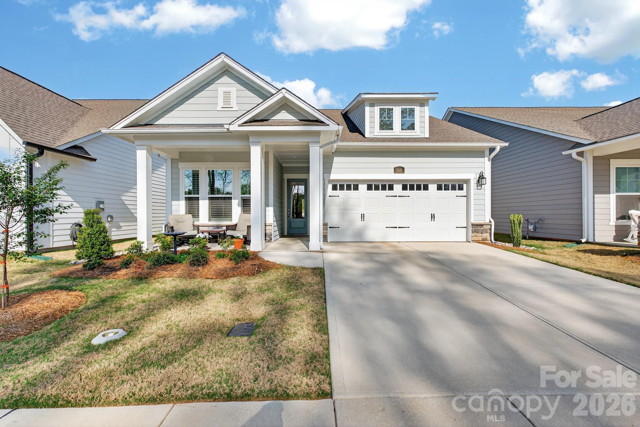 Welcome to 1030 Idyllic Lane in the esteemed 55+ community of Encore at Streamside. This stunning single-story home beautifully combines comfort with style, featuring 2 spacious bedrooms, 2 full bathrooms, and nearly 1,632 square feet of inviting living space. The heart of the home boasts an open and airy layout, perfect for entertaining friends or enjoying quality family time, enhanced by ample natural light. Step outside to the spectacular rear screened in covered porch, an exceptional paver outdoor living area ideal for relaxation or alfresco dining. Situated in the sought-after area of Waxhaw, the home offers convenient access to shopping and recreational activities. With its contemporary design, high-quality finishes, and desirable features, this residence is truly a must-see.