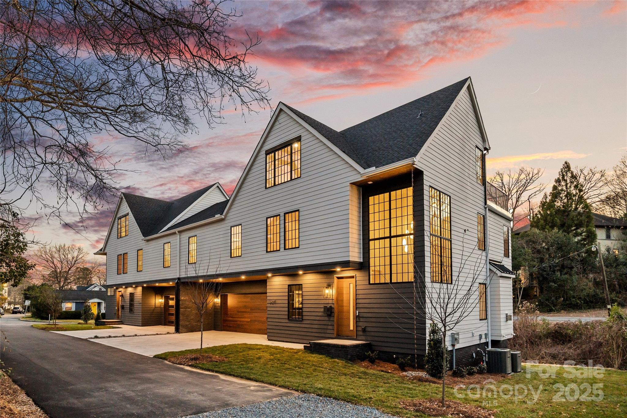 An extraordinary custom designed residence showcasing distinctive style with ample space for both relaxation and entertainment. From the double height chandeliered staircase windows to the carefully considered living spaces, this home offers a true sanctuary in the city. Open living area features soft, elegant design palette, fully vented fireplace, cove-lighted crown moulding, gorgeous lighting and Juliet balcony, anchored by the tasteful chef's kitchen. Outfitted with quartz counters, professional GE Cafe stainless appliances and custom hand-built full wood cabinets. 36” Range with integrated hood, wifi-connect built-in wide refrigerator with ice-maker, and island with microwave drawer; mini-pantry. Main level office/formal dining/lounge with lighted pocket doors. The luxurious Primary Suite offers a dramatic sense of space. A serene retreat w/ spa-inspired en-suite bath, curbless shower, soaking tub, double vanity and private toilet stall. Large walk-in hand-built closet. Every spacious bedroom has a full bath. 3rd level loft suite offers flexible living options from media room, entertainment space, or as a fourth bedroom with full bath. Clever ‘Secret Room’ behind standard closet can also be an extended walk-in closet or storage space. Top floor is where the party happens as you unwind outside on your large hardwood, 3rd level terrace, perfectly suited for sophisticated entertaining with 7 ft serving window via kitchenette, quartz exterior bar top, outdoor TV and A/V connections & fire pit with gas hookup. This brand new duet home boasts a comprehensive list of exceptional luxury amenities, incl elegant multi-paned full wood/aluminum clad windows single-sourced from forest to fabrication in USA, HERO Energy compliant, white oak flooring, 'secret room', mud/drop zone, upgraded A/V package, video doorbell, fully insulated crawl space, stunning 3rd level wood terrace, architectural and metal roof, and large 2-car attached garage. Nestled within a quiet cul-de-sac, you're never more than a few minutes from all that beautiful Plaza-Midwood has to offer. Walk to Central Ave restaurants/venues, or ride your bike to the greenway. Close to the Blue Line, freeways and Uptown
