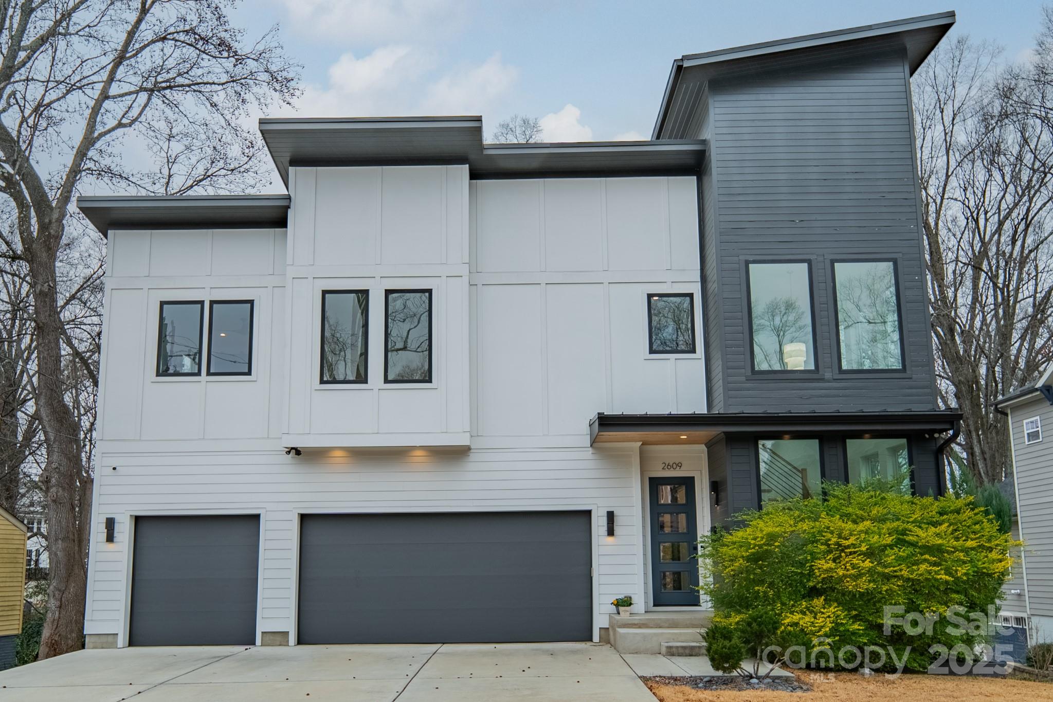 Stunning, modern 2021 build with an abundance of light streaming in on natural color hardwoods. Quartz waterfall kitchen island, gas stove, wet bar with beverage and wine refrigerators, scullery style pantry with floating shelves and cabinetry. Open kitchen/living with floor to ceiling tiled gas fireplace and wall of sliding glass doors opening to the wonderful covered porch with Modifier Outdoor Gas Fireplace, all overlooking the fully fenced back yard. Upstairs the primary suite has its own covered porch, soaking tub with decorative wall surround and tiled shower with window. Primary walk in closet has custom wood shelving cubbies making it easy to stay organized! The second bedroom has an ensuite bathroom and bedrooms two and three share the large hall bathroom with dual vanity sink. Double barn doors open to a bonus room/study across from the laundry room with cabinetry and counter space. Tankless water heater, dog washing station in garage. Beautiful views of the uptown skyline!