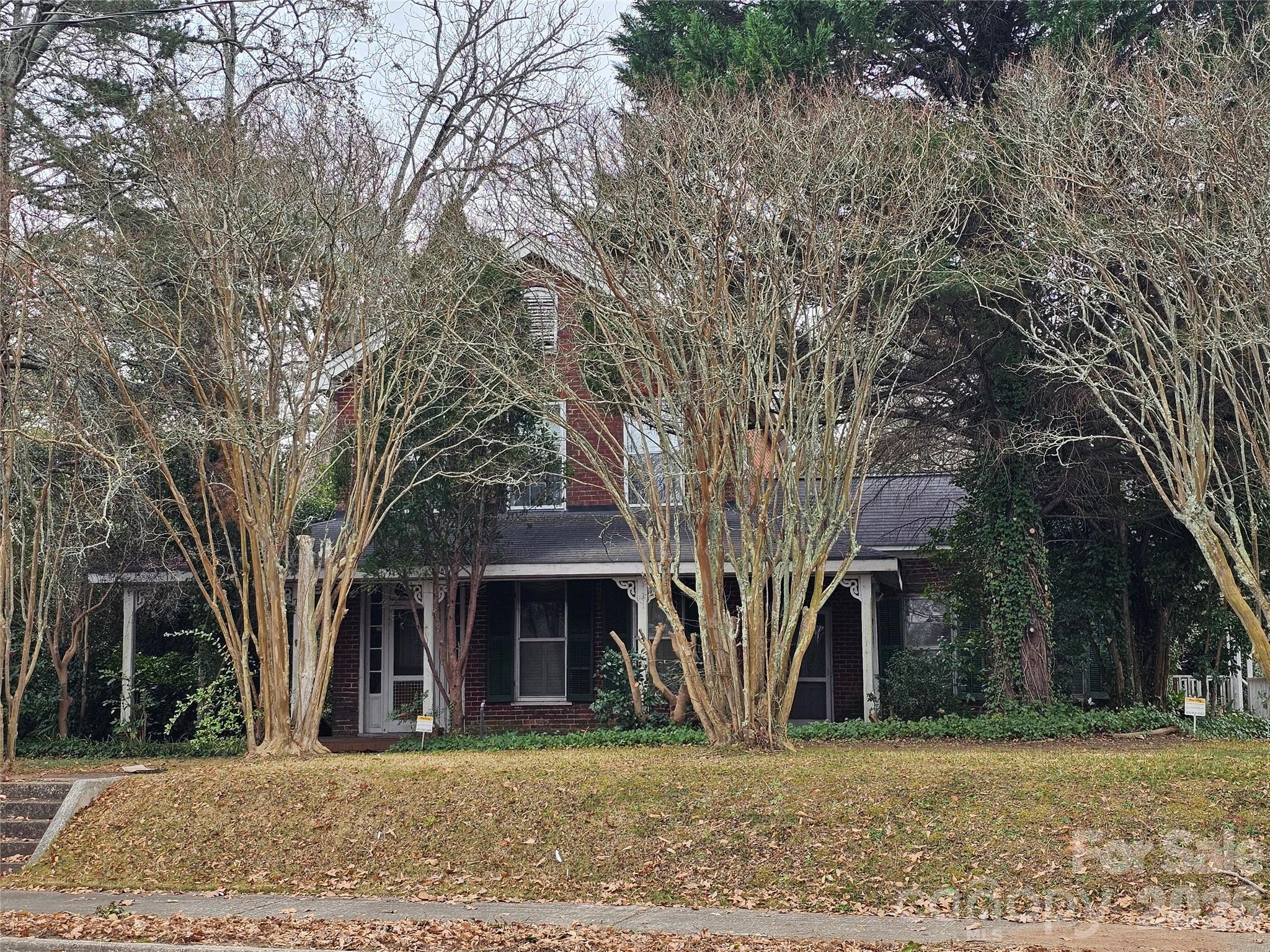Step back in time and discover the timeless charm of this one-of-a-kind century home. More than 100 years of historic character await a new owner who will appreciate the hardwood floors, the mahogany staircase handrail and the sunbaked brick that's part of the interior charm. But can also add their own personal touches to the home. The large yard offers a private area for relaxing and entertaining. The home is within walking distance of downtown.