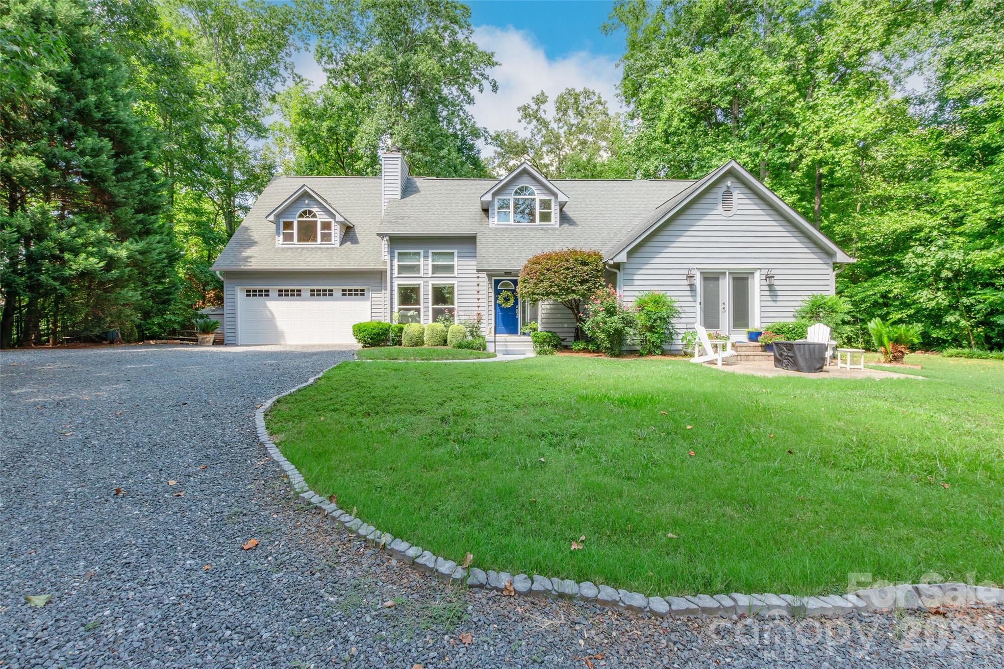 Nestled on 3.08 private acres, this beautiful 4-bedroom, 2.5-bath home offers the perfect blend of space, comfort, and peaceful country living. A welcoming circular driveway and attached double garage provide both convenience and curb appeal. Inside, you'll find a spacious layout designed for everyday living and entertaining, with generously sized bedrooms and plenty of room to spread out. The walk-in attic offers abundant storage and the potential for future expansion. Surrounded by acreage with room to enjoy the outdoors, this property provides the privacy you've been looking for while still offering the comforts of home. Don't miss this rare opportunity to own a home with acreage and endless possibilities!