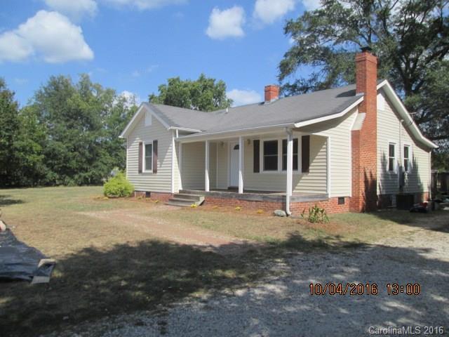 Remodeled farmhouse with open floorplan.  Covered front porch and oversize deck in back.  Fully matured trees around the house.