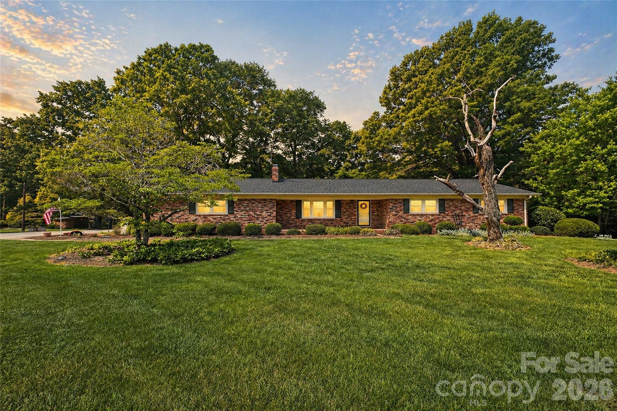 Tucked away on nearly 7 acres of private, naturally wooded land, this property offers a rare combination of space, seclusion, and flexibility just minutes from the convenience of Statesville. Surrounded by mature foliage and set back from the road, the setting delivers a quiet, retreat-like atmosphere ideal for those seeking privacy without sacrificing accessibility.

Originally built in 1972 and thoughtfully expanded in 2001, the home offers over 2,300 square feet of living space designed for both comfort and versatility. The standout feature is a spacious great room addition with vaulted ceilings and a fireplace, creating a warm and inviting central living space filled with natural light. This area flows seamlessly to an oversized rear deck, providing the perfect setting for outdoor entertaining, quiet mornings, or enjoying the peaceful natural surroundings.

The property’s 6.89 acres are a blend of cleared and wooded land, offering a balance of open usable space and privacy. The backyard features established garden areas, ideal for those looking to grow their own vegetables or create a personalized outdoor living environment. A secondary well on the property supports irrigation and landscaping needs, adding functionality for gardening enthusiasts or those seeking a more self-sufficient lifestyle.

Inside, the home is rich with character and presents an excellent opportunity for a buyer to personalize and update to their own style over time. Hardwood flooring runs through much of the home, while the layout offers flexibility for a variety of living arrangements. The unfinished basement provides additional space ideal for a workshop, storage, or future expansion based on your needs.

Recent improvements include a new roof installed in 2023, offering peace of mind and long-term value. The home is serviced by city water, with the added benefit of the private well for exterior use. With no HOA restrictions, the property provides the freedom to truly make it your own.

Whether you’re searching for a private retreat, additional space to spread out, or a property with long-term potential and flexibility, this home presents a compelling opportunity to create something truly special.