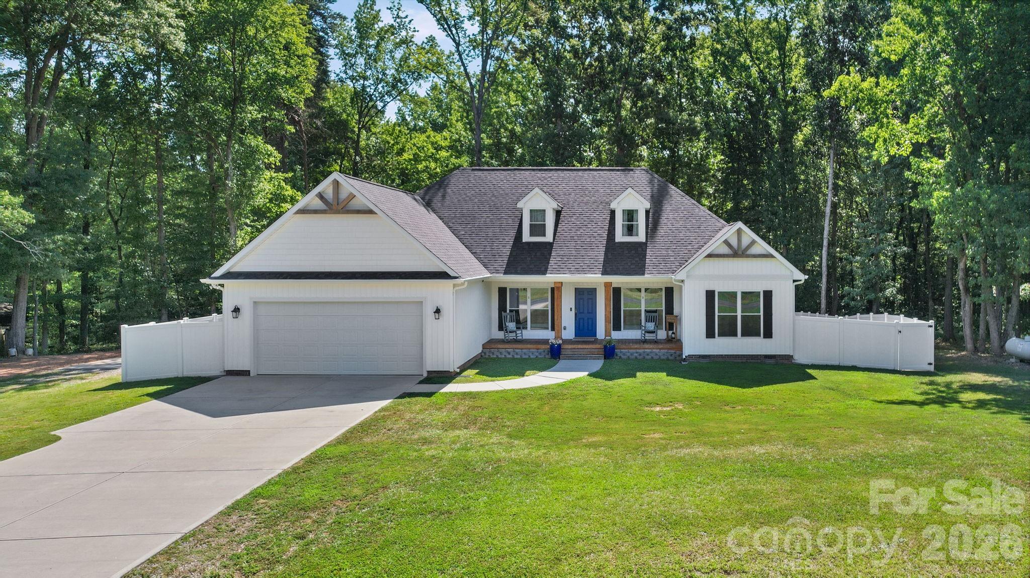 Welcome home to 3002 Brooks Mill Lane! Built in 2021, this exceptional custom home is loaded with thoughtful upgrades and quality craftsmanship, offering the perfect blend of style, comfort, and functionality.

Start your mornings on the inviting rocking chair front porch while enjoying peaceful country sunrises. Inside, you'll love the open-concept design with a desirable split-bedroom floor plan that offers both comfort and functionality.

The gourmet kitchen is truly the heart of the home, featuring custom cabinetry with built-in organizational features, granite countertops, a stylish tile backsplash, a gas range, abundant counter space, and an oversized island perfect for gathering. The living room makes a statement with its floor-to-ceiling shiplap fireplace featuring gas logs and a beautiful natural slate surround. Even the space beneath the staircase has been thoughtfully transformed into a custom dog kennel, proving no detail was overlooked.

The spacious primary suite offers a relaxing retreat with a dual-sink vanity, soaking tub, separate tiled shower, and a professionally designed Wolfe closet system that maximizes storage and organization. The secondary bedrooms are generously sized. The laundry room is just as impressive, featuring an entire wall of custom cabinetry that provides exceptional storage and organization. Upstairs, you'll find a versatile bonus area that can easily serve as a craft room, hobby space, fitness room, media room, home office, or additional flex space. An entire wall of built-in cabinets and cubbies makes keeping everything organized effortless.

Premium upgrades continue throughout the home, including spray foam insulation for outstanding energy efficiency, high-end bidet toilets with motion-activated lids, a three-zone HVAC system for customized comfort, and an oversized 8-foot tall garage door that provides additional clearance for larger vehicles.

Outdoor amenities are just as impressive, featuring a fenced backyard, rear patio, a 12' x 32' Tuff Shed, and a 12' x 20' concrete pad complete with a 50-amp RV hookup. For added peace of mind, the home is equipped with a 24kW Generac whole-house generator that automatically powers the entire home during outages.

From the carefully selected finishes to the extensive list of upgrades, this home reflects pride of ownership at every turn. Meticulously maintained and thoughtfully designed, this is a rare opportunity to own a truly move-in-ready property with features that are difficult to replicate.

Bonus Room Disclosure: The home offers approximately 2,466± square feet of reported heated living area, with approximately 550± square feet of unpermitted finished bonus space completed by the seller.