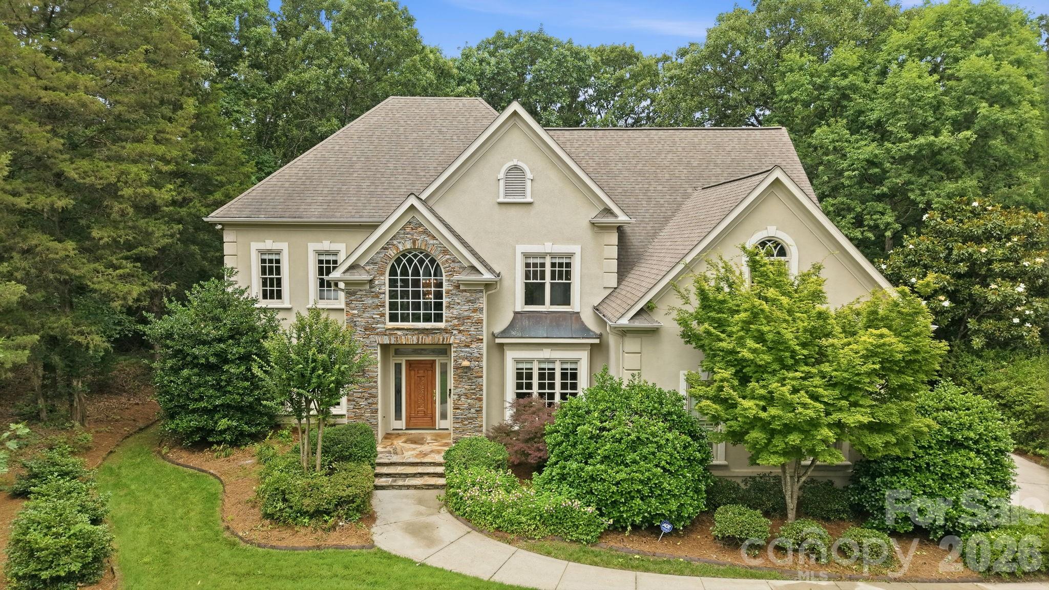 Welcome to this stunning 4-bedroom, 4-full-bath home located in the highly sought-after Ballantyne Country Club community. Situated on a spacious 0.51-acre lot, this beautiful home features hardwood flooring throughout, creating a warm and timeless feel. The kitchen is equipped with granite countertops, stainless steel appliances, and ample space, making it ideal for both everyday living and entertaining.

The thoughtfully designed floor plan offers four full bathrooms, including two recently updated with stylish tile finishes. Enjoy outdoor living on the private patio overlooking the expansive backyard, providing a peaceful setting for relaxing or hosting guests.

An oversized two-car garage offers exceptional storage space for vehicles, tools, and recreational equipment. Located within a premier golf course community, residents enjoy access to outstanding amenities including a community pool, sports courts, walking trails, and more.

This is a rare opportunity to own a beautifully maintained home in one of the area's most desirable neighborhoods, offering luxury, convenience, and an exceptional lifestyle.