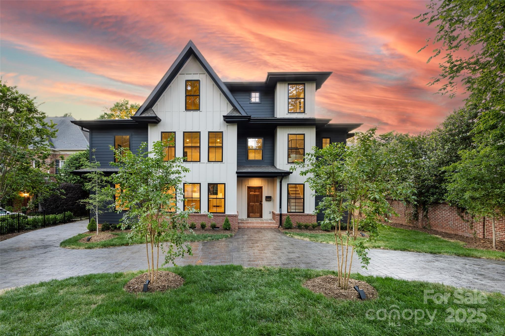 Stunning custom new construction in the heart of Myers Park! Built by Westwood Custom Homes, this modern craftsman offers 5 bedrooms, 4.5 baths, and a thoughtfully designed floor plan with high-end finishes, tall ceilings, and beautiful hardwoods throughout. The main level features an open-concept layout with large living room, dining room, and chef’s kitchen equipped with top-of-the-line appliances, scullery with wine fridge, and generous island. Primary suite on main includes a gorgeous en-suite bath with soaking tub and walk-in closet. Upstairs you’ll find three bedrooms, laundry and an oversized bonus room. The third floor offers exceptional flexibility with a full kitchenette and bonus room, as well as a guest bedroom with ensuite bath, plus a dedicated office space. Outside includes a fully fenced private yard, patio, irrigation, and landscape lighting. Circle drive with ample parking and side entry for added convenience. Built for modern living with timeless craftsmanship!