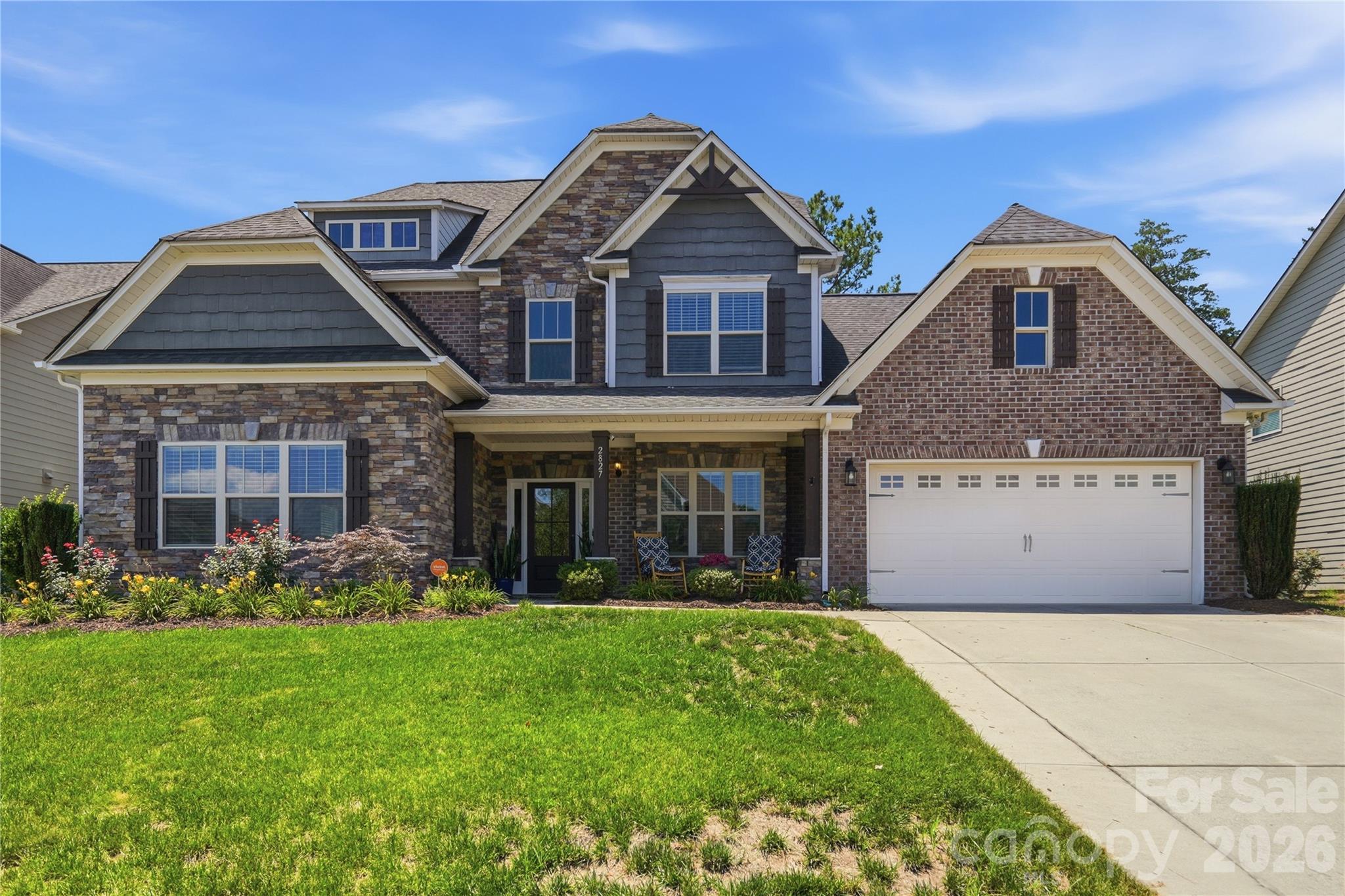 Elite Entertainment and Resort-Style Living in Kellswater Bridge! Nestled on a highly desirable, private cul-de-sac lot backing to a serene backdrop of mature trees, this stunning 5-bedroom, 3.5-bathroom home offers nearly 4,000 square feet of meticulously maintained living space. Step past the covered front porch onto gorgeous hardwood floors that flow seamlessly throughout the entire main level. The heart of the home features a chef’s dream kitchen boasting a massive central island, a brand-new gas stovetop with a premium vented hood, a wall-mounted double ovens, a new garbage disposal, and abundant storage.

Unwind in the oversized primary suite, conveniently located on the main level, featuring brand-new carpet, a private sitting retreat, and a massive walk-in closet. A beautiful butler's pantry links the living and dining spaces, leading the way upstairs where you will discover a show-stopping bonus space equipped with its own kitchenette, creating the ultimate, elite home theater experience.

Enjoy your morning coffee on the screened-in porch or host weekend gatherings on the newly extended back patio inside your private, fenced backyard. Incredible mechanical upgrades and peace of mind come standard, including two brand-new AC units, brand-new windows protected by a lifetime warranty, new gutters with protective screens, and brand-new wooden blinds installed throughout. Complete with a widened driveway that effortlessly accommodates extra vehicles side by side, all of this is just a short walk from Kellswater Bridge’s premier resort-style pool, fitness center, clubhouse, tennis courts, basketball courts, and greenway trail access.
