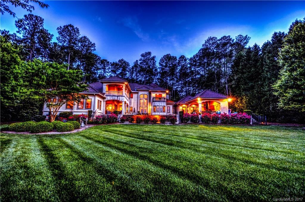Waterfront Estate... Privacy, elegance & comfort...on almost a FULL ACRE LOT! This is not just a home, it's a lifestyle. Close to DOWNTOWN CLT and the TRIAD. Breathtaking Views in almost every room 2 story foyer, Travertine Tile floors, stunning custom kitchen, study, office and a fabulous GREAT room are just a few of the things that await you inside...Outside boasts a saltwater infinity pool and hot tub...cabana kitchen...new dock, and much more...DO NOT MISS THIS LAKEFRONT GEM!