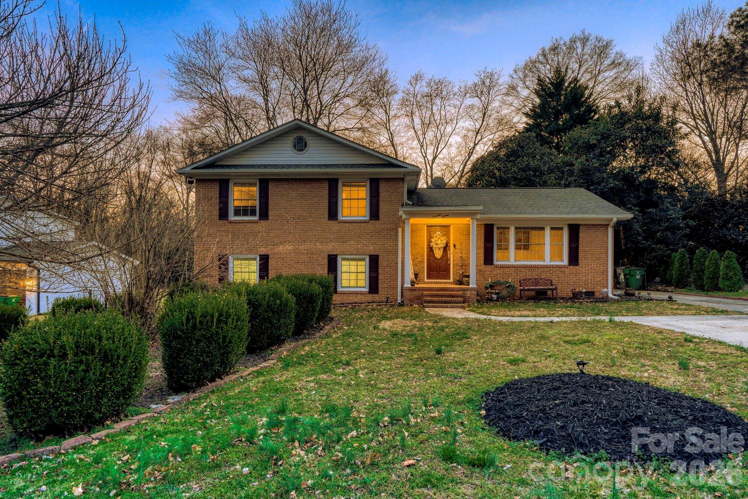 Come visit this must see home nestled in lovely Cotswold! This all brick, split level home sits in the perfect location on a dead end street and just minutes downtown Charlotte! This home features 4 bedrooms, 2.5 upgraded bathrooms, upgraded kitchen, hardwood floors and tile throughout, and a fully encapsulated crawl space and upgraded HVAC! Upon entering the home you'll be welcomed on the foyer attaching the front family room perfect for an office or playroom. Head down the hall to your dining area and upgraded kitchen with granite countertops. Head upstairs and you'll find your primary bedroom with attached en suite and your two upper bedrooms and additional full bathroom. Head back downstairs to your lower level where you'll find your living room with gas fireplace, additional oversized bedroom, laundry room, and 1/2 bathroom. Head outside to your covered back patio and large fenced in back yard. Don't miss this one, it won't last long!