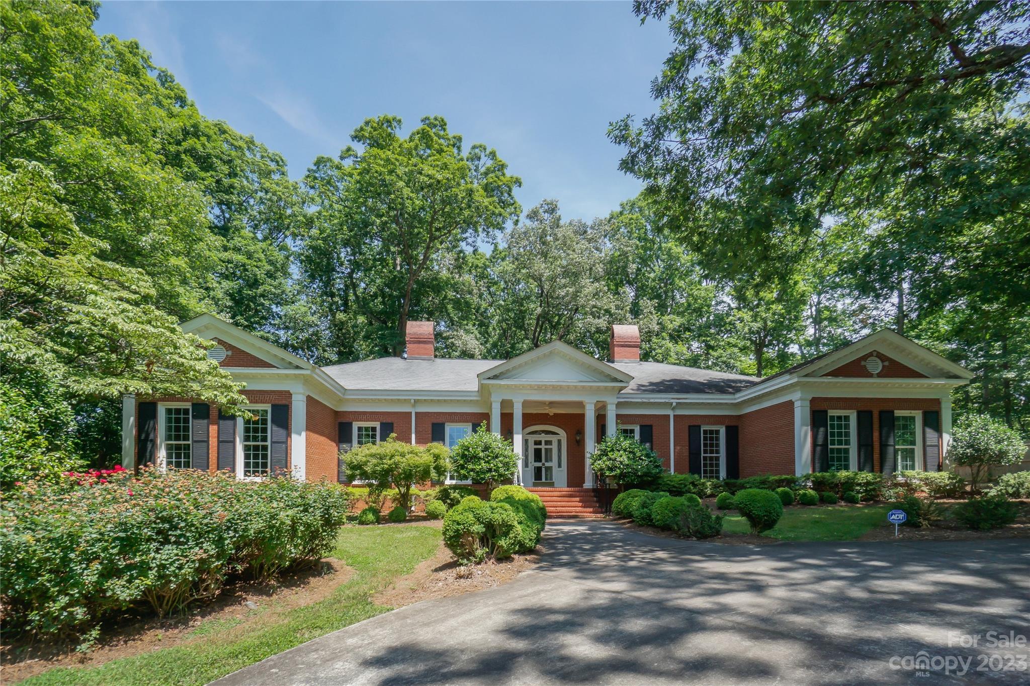 This exceptional Georgian style house in Forest Hills is a must-see!. With over 5000 sq ft, it offers 5 bedrooms & 6 full baths. Built in 1955 on two lots, the property boasts a generous size yard providing ample outdoor space. The double garage in the back & the circle drive in the front offer convenient parking options. Upon entering the home, you'll be greeted by a spacious foyer adorned with a custom-built staircase. On either side of the foyer, you'll find a stunning dining room & an elegant living room, both boasting fireplaces. The kitchen is conveniently located next to a breakfast room. The interior features beautiful molding trims, exquisite light fixtures, large windows. The main floor is particularly impressive, featuring 3 bedrooms, each w/ its own full bath. Two of the bedrooms include walk-in closets w/ generous dressing spaces. One of the bedrooms has been utilized as a library. The exterior features freshly painted trim work and columns, as well as a fenced back-yard.