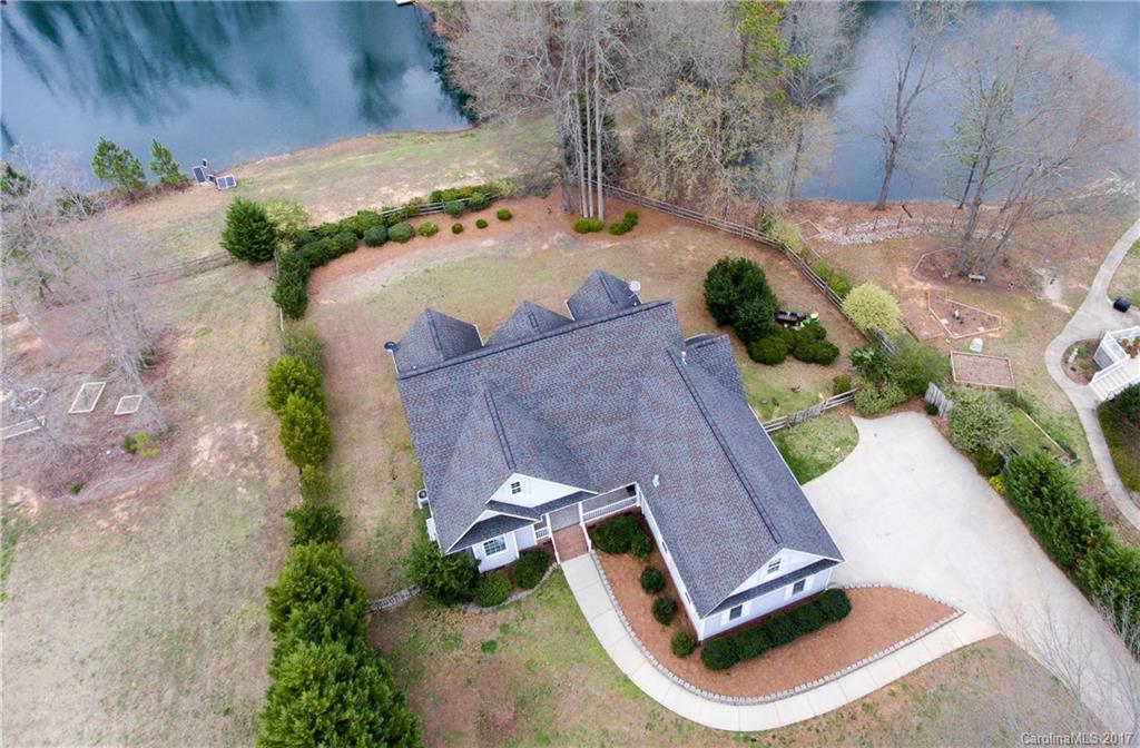 Come home to this quiet country setting and enjoy time on your screened in porch overlooking the pond or greet your friends and family on the inviting covered front porch.  Entertain in the open floor plan or opt for summer cookouts on the private 1+ acre lot.  The large bonus room upstairs offers additional space while the master bedroom features his and her vanities, his and her closets, a double tray ceiling, garden tub and views of the pond.  The main living areas also overlook the pond.