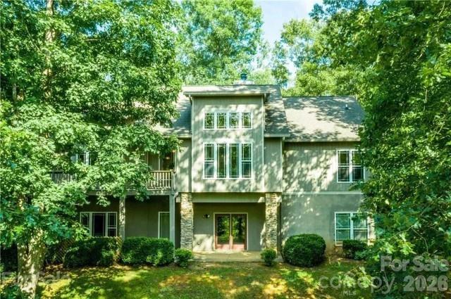 Enjoy the best of mountain and lake living in this beautifully updated Lake Adger retreat, complete with a deeded boat slip just minutes away. This furnished 4-bedroom, 3-bath home offers 4,209 square feet of comfortable living space, including a 3-car garage, remodeled kitchen, expansive windows that bring in natural light, a finished lower level with additional living space and guest bedroom, and an oversized laundry room. 
The home has seen many significant updates in recent years, including kitchen cabinetry, appliances, plumbing repipe, water heater, pressure tank, HVAC system, rear gutters, rear deck, toilets, fencing, custom shades, mini-split, and more. The large fenced backyard offers space for pets, gardening, and outdoor enjoyment. A drive through rear gate with a gravel drive provides convenient access to the storage shed, workshop area, and lower-level exterior entrances. 
Located in the desirable Lake Adger community, residents enjoy a peaceful, well-kept mountain setting with low HOA dues, convenient access to walking and riding trails, and the added benefit of a deeded Lake Adger boat slip.