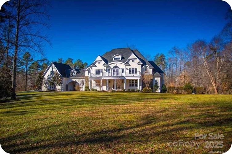 Private Gated Community lead you to this Estate Style Custom Home on 6.29 Acres. This Beautiful 6 bedroom home boasts over 7800 sq/ft with huge bright oversized rooms and an open airy floor plan. The two story foyer and the newly refinished Brazilian Cherry floors greet you as you enter. The Gourmet Kitchen features S/S Appliances and a Huge Granite Island for entertaining. A Gorgeous Main Level Master Suite w/Lg. walk-in closet open to an Outdoor Lanai with a Resort Style Custom Saltwater Pool and Jacuzzi. Additional features include a Movie Room, Home Gym, 4 Car Garage and a Customizable Basement Workshop and much more... Less than 10 minutes from Lake Norman and 20 Minutes from downtown Charlotte make this private luxury estate very desirable.