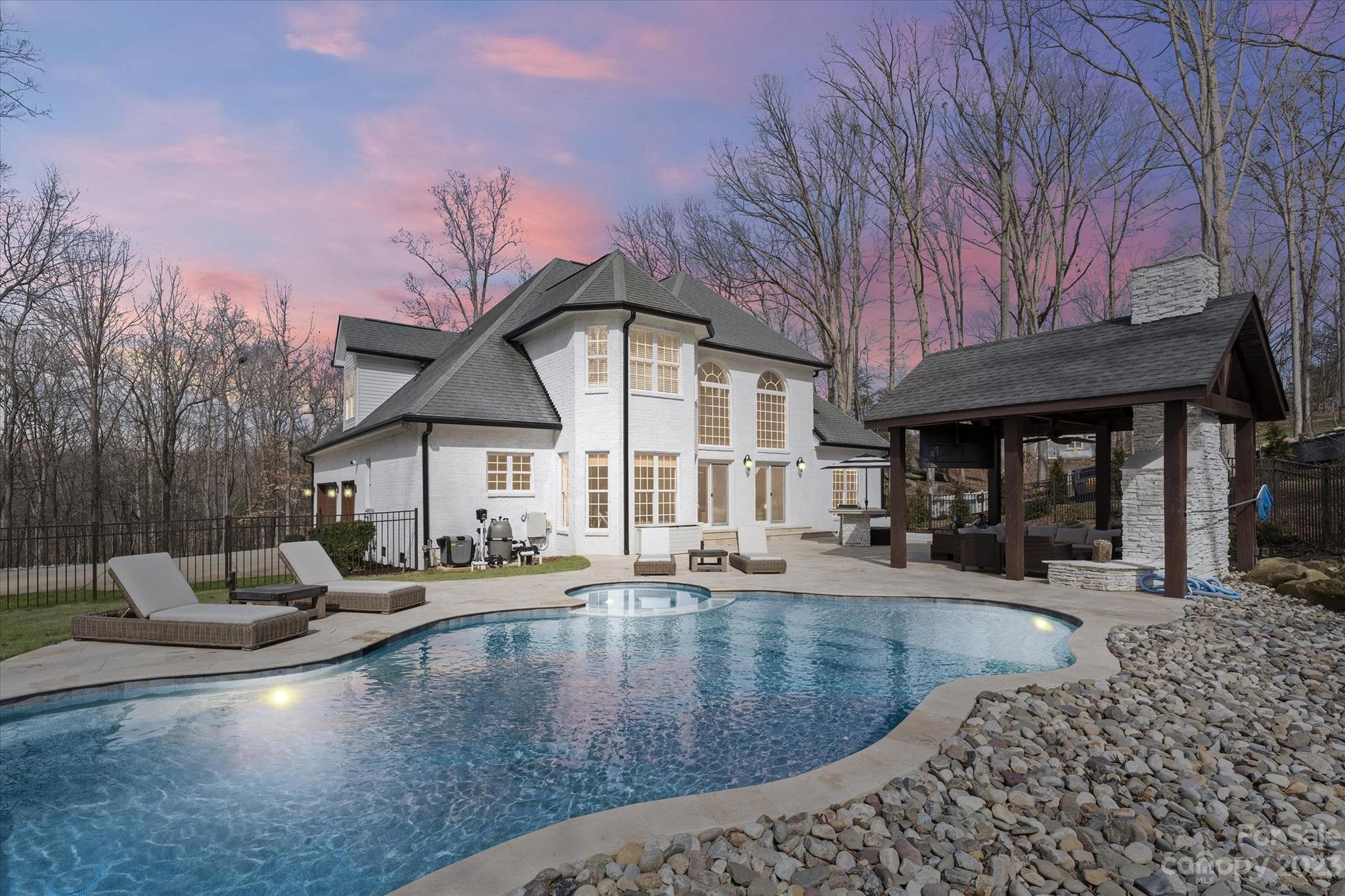 WELCOME HOME to this stunning 4BR 2.5Bath Home In Greenbay Forest on 2 ACRES WITH BRAND NEW POOL, HOT TUB & 3 car garage! This full brick home is nestled on 2 acres w/ tasteful updates throughout the interior & exterior of the home. Fully painted in 2023 and whitewashed brick brings a new feel to a timeless look. Updated kitchen, bathrooms, bamboo flooring throughout, custom accent wall in great room above fireplace, to name a few. Primary en suite is a delight and adjacent to the main living areas. 3 addt'l BRs upstairs w/ a bed/bonus that is currently equipped as a home gym. Enjoy your very own outdoor oasis where you can vacation every day! Full in ground pool w/ hot tub installed 2022, w/ travertine decking added surrounding pool & backyard. Updated built in grill station w/ new grill & relocated. Pergola has been repainted & fireplace whitewashed to match. Don't miss out on this opportunity!