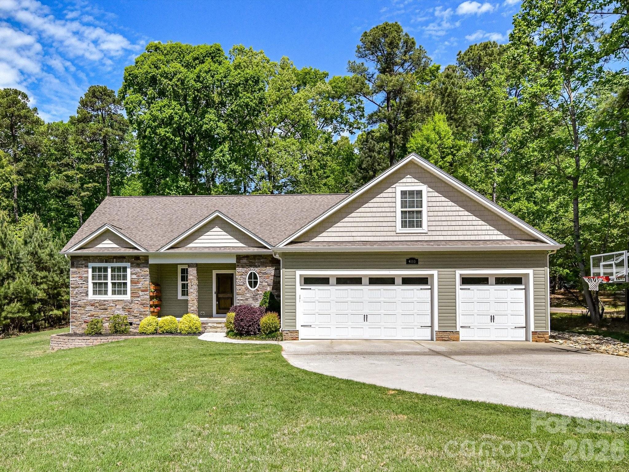 Come see this GORGEOUS custom built home that is packed with special features and updates!  
First of all the location on the Mayhew peninsula is ideal if you are looking to get into top rated schools and access to all that Mooresville has to offer, especially: Lake Norman!  With a public boat ramp and picnic area just at the end of Mckendree Road, you can be on the lake within minutes.   This home also sits on .7 of an acre of level and usable land which is unusual this close to the lake.   As soon as you pull up you will be charmed by 488 Mckendree and it wont stop when you see the expansive front yard, the 3 car garage and ample parking!  When you enter you will see the newly refinished hardwood floors, lovely gas fireplace in the living room and the kitchen with fantastic granite countertops, Bosch appliances is right there where it should be... in the heart of the home.  The living room, primary and back patio all have surround sound system installed.  This home also features a bonus room above the garage as well as a walk in attic with custom storage shelving!  Additionally, the new paint, light fixtures, carpet in the bedrooms and updated vanity in the guest bath and other thoughtful changes give the home a nice refresh for the new owners!  All of this and more, and NO HOA!  Come take a look!  Coming to market EARLIER than expected!  If you want to see this one, schedule a visit asap.  Professional photos coming soon.