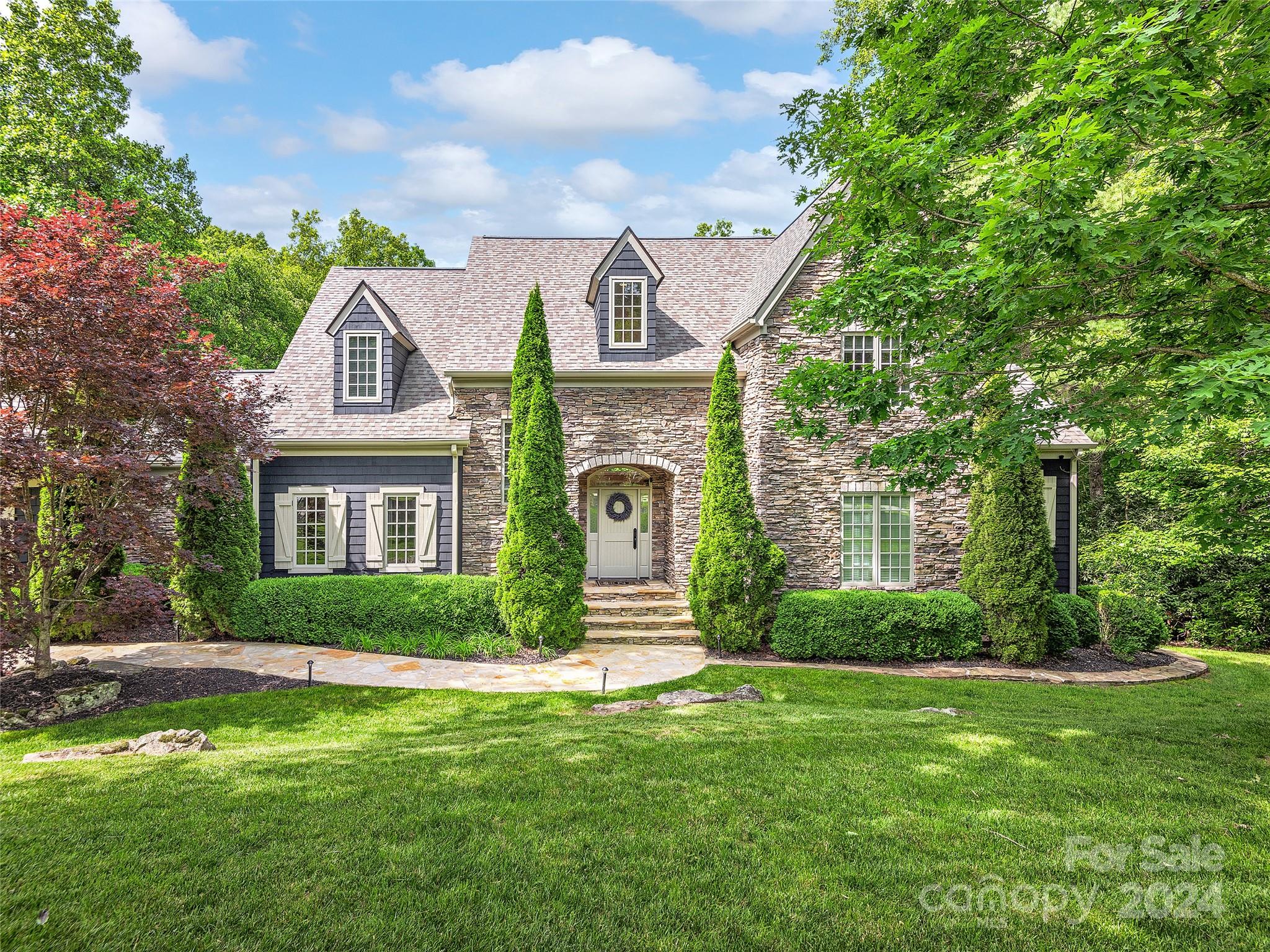 Welcome to your fully updated dream home in prestigious Biltmore Lake! This exquisite 6BR, 5/2.5BA home offers elegance, comfort & modern amenities in the gated Scott's Ridge community. Key features include spacious living areas with an open floor plan, high ceilings, floor to ceiling windows & hardwood floors. Gourmet kitchen with stainless Wolf & Sub-Zero appliances,Cambria countertops & large island. Expansive primary suite has a spa-like bathroom with soaking tub, dual vanities & walk-in shower. Five additional bedrooms include three with private baths. Entertainment spaces: family room with fireplace, formal dining, home office. Finished basement: large family room, media room for film screenings & guest quarters. Billiard room with full bar & wine refrigerator. Private outdoor oasis: Landscaped yard, heated salt water pool, stone fireplace, hot tub, 2nd level deck. Detached three car garage & additional garage shop. Furniture and/or electronics package available for purchase.