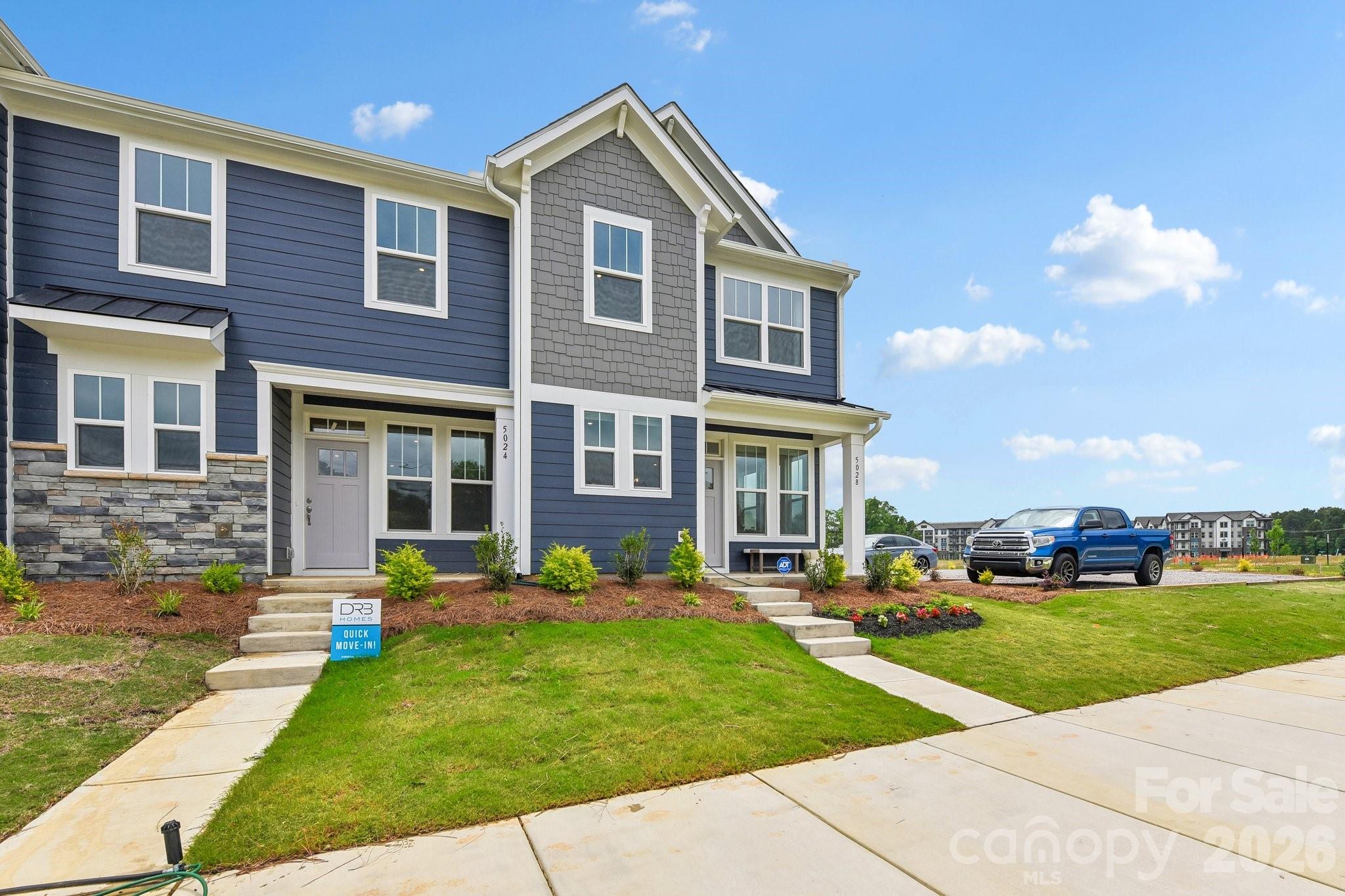 Welcome to Odell Park Premier Townhomes Offering the Most Convenient Access to Regional Commuter Routes and Concord Mills. Our Rochester plan features 3BR / 2.5BA  with a 1-car garage offering modern design and practical spaces just minutes to I-485 , Highland Creek, and Concord Mills Blvd. The main level features an open-concept layout with luxury vinyl plank flooring. The kitchen includes quartz countertops, stainless steel appliances, a spacious island, and an approximately 12' deep finished storage closet—ideal for pantry or utility use. A bright dining area and connected family room make the space inviting for both daily living and entertaining. Upstairs, the Rochester plan offers three bedrooms, two full baths, and a convenient laundry closet. The primary bedroom and bathroom highlight a 5' tiled shower, dual vanities, and a large walk-in closet. Secondary bedrooms provide flexibility for work-from-home, guests, or hobbies. Odell Park offers quick access to  shopping, dining, parks, major highways, UNC Charlotte, and local employment centers. HOA services cover water, trash removal, lawn care, and landscaping, supporting a low-maintenance lifestyle in a convenient Charlotte location. This home is ready for a Quick Move - In.