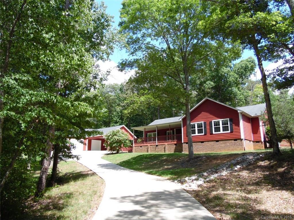 Country quiet awaits in this lovely 3 BR/2 BA home tucked among the trees! Move in ready featuring new carpet, new appliances & more. Enjoy the outdoors from the sprawling front & rear porches or host a gathering in the 3 car det garage (currently converted for entertaining). Gorgeous interior features spacious kitchen w/extensive cabinetry & private master retreat. A rare find! Strongly encouraged that offers include proof of funds/pre-approval & is required for seller's final acceptance.
