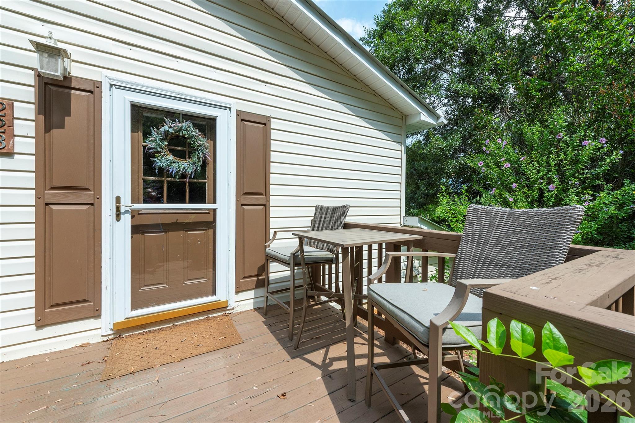 This cozy duplex is ideal for someone looking to live in one unit and rent the other. The upper unit is a fully furnished studio that has been a successful short term rental for years. The lower unit has a full kitchen, updated bathroom and a large flex space that could be arranged as a bedroom and living area. The large level yard has three storage buildings, a fireplace, and a view of the mountains. The shared laundry is access from outside, but a door could be added to the lower level for interior access. The three outbuildings include a workshop with shelving, two levels, and electric, the second is being used to store fire wood, and the third is waiting for your chickens. Close to both Black Mountain and Asheville, this slightly off the beaten path location is also minutes from local favorite hiking trails like those on Warren Wilson College, Owen Park and the soon to open Swannanoa Pump Track. Come buy yourself a piece of land in Swannanoa, a vibrant community bouncing back in style! Check out all the new businesses in Beacon Village while you're in town!