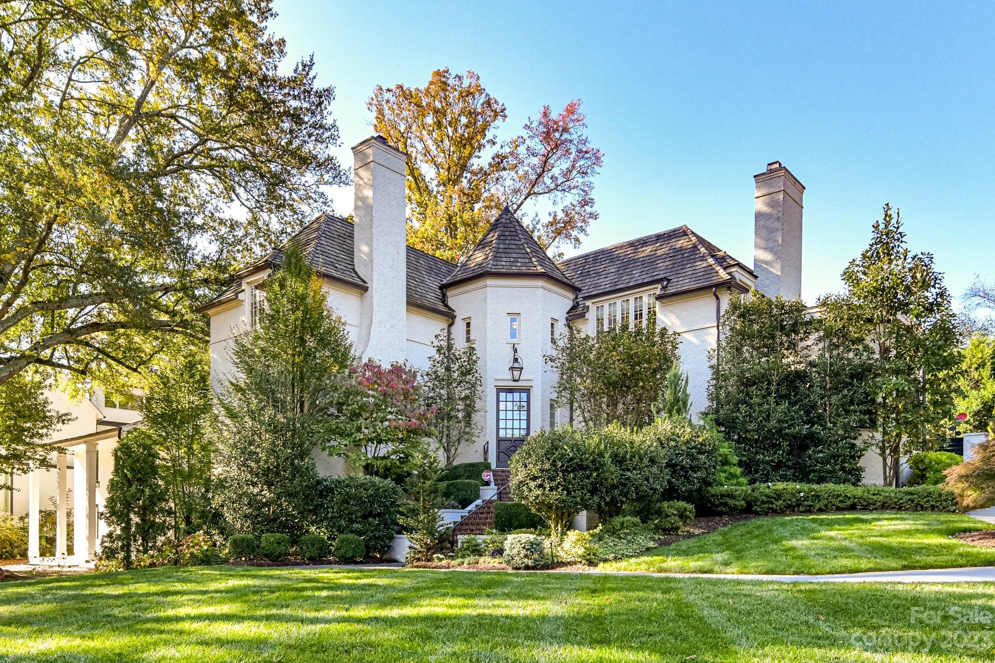 This luxurious Eastover home offers the perfect blend of comfort & elegance. A beautifully landscaped corner lot has a sweeping front lawn, w/a custom & thoughtful design allowing the homeowner to enjoy varied blooms & foliage throughout the year. Inside you'll find high-end finishes & premium materials throughout. The open floor plan creates a sense of flow & connectivity between the varied living spaces, while large windows flood the home w/natural light. The primary is particularly impressive w/a spa-like bathroom including a soaking tub, double vanities & luxurious shower system. The bedrooms are spacious & luxurious w/ample closet space & ensuite bathrooms featuring modern fixtures & finishes. The lower level offers a theatre room, addl. kitchen, workout room, guest suite & rec room. A private yard offers a serene & secluded oasis that is perfect for relaxation & enjoyment offering an enclosed veranda w/fireplace, grilling station for dining & lush turf area overlooking the pool.