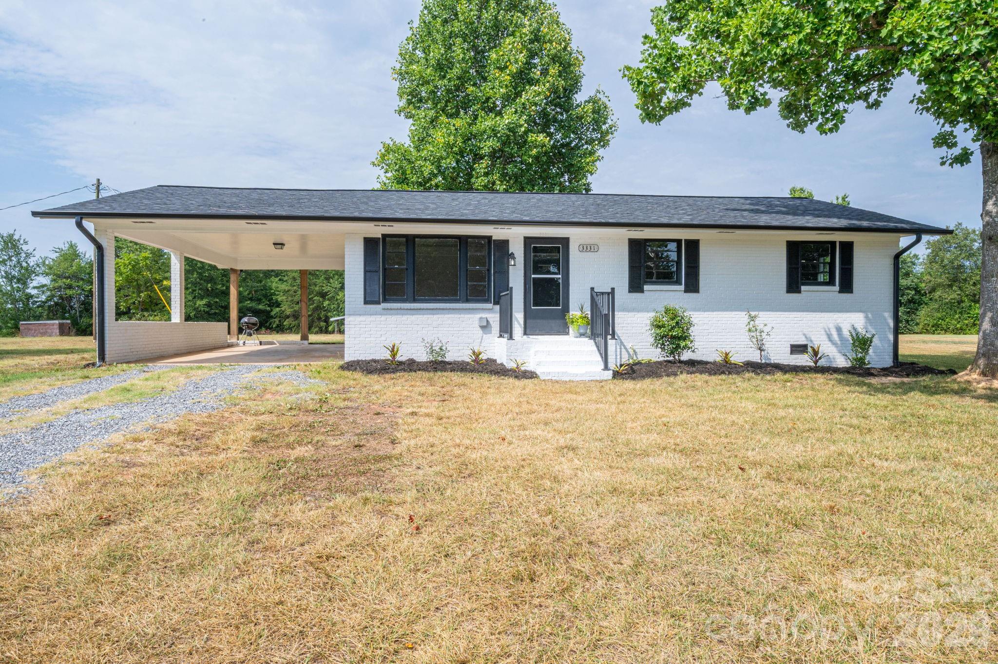 Looking for outdoor space? Checkout this 3BR 1BA Brick ranch situated on a 2+/- Acre lot in the heart of Vale NC!  Featuring a beautiful white exterior painted brick giving it the farmhouse look. New roof in '25, Interior floor coverings, kitchen cabinets with granite etc. Functional layout with dedicated living room, open kitchen/dining nook. Attached one car carport. The highly coveted large corner lot provides numerous possibilities with room for a building and multiple access points! Need more space? Approx 12+/- acres for sale behind the property at 00 Frank Cline Road. Please note, final lot size subject to new survey if land is not purchased with the home.