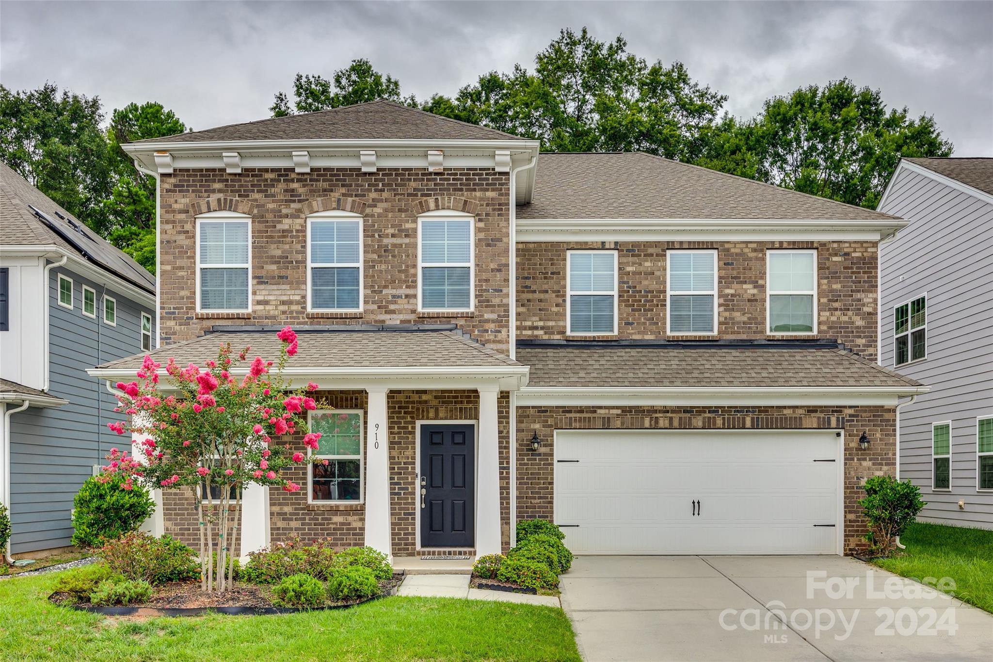 Discover Carolina living at its finest in this 5 bedroom residence, where elegance meets comfort. Highlighted by a main floor bedroom with en suite, a French door office, and an expansive open concept floor plan, this home offers seamless transitions between living and entertaining spaces. Gas, stainless steel appliances in the kitchen. Upstairs, a spacious loft compliments additional secondary bedrooms and an owner's suite, providing ample space for relaxation and privacy. A large upgraded patio with pergola and stone gas grill is a must see for this property. Located in award winning Fort Mill School district, this neighborhood's location is an absolute perk being close to Anne Springs Close Greenway, the Recreation Pickleball Courts and downtown Fort Mill, minutes from Ballantyne and highway access.