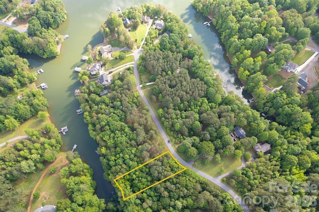 Opportunity knocks to build your dream home on one of the few remaining waterfront lots in the private, gated Riverwalk community. This sloping lot, levels at the lake and gives you the opportunity to create a sandy beach area that you can launch your paddleboards or kayaks to enjoy the lake. Nestled along the tranquil shores of Lake Lookout, this sought-after neighborhood is known for its peaceful setting, scenic beauty, and abundant outdoor recreation. Residents enjoy exclusive access to a sandy beach area, covered pavilion, perfect for gatherings and cookouts, a convenient boat launch, and multiple day-use boat slips. Whether you're an outdoor enthusiast, nature lover, or simply seeking a serene retreat, Riverwalk offers the ideal setting to create a custom home tailored to your lifestyle. Don't miss this rare opportunity to own this beautiful property at an unbelievable price in this desirable lakefront community!