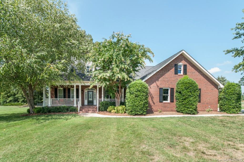 Location, Location! Beautiful, custom 4 side brick home on almost 1.5 acres in a tranquil country setting. Close to shopping, Rt 521 & Ballantyne. Stunning site finished hardwds on 1st floor, spacious master down suite w/completely renovated spa-like master bath. Large great rm w/brick fireplace overlooking private yard.  Upgraded kitchen w/granite counters & ss appliances. 2nd flr oversized bonus, playrm, craft rm & office. Plenty of storage, fenced yard, country porch & custom outdoor playset.