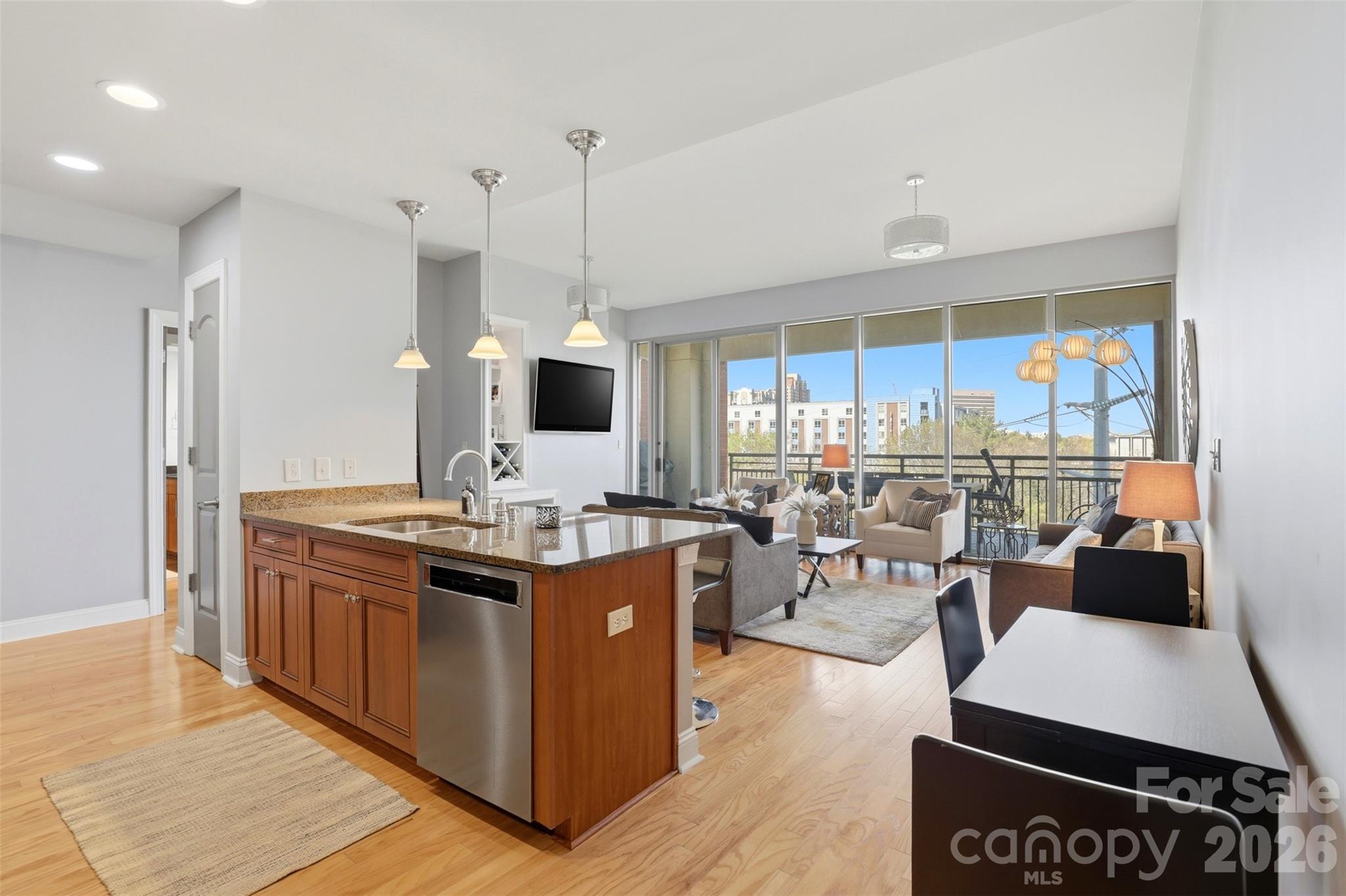 Experience elevated urban living in this beautifully appointed luxury corner-unit condo, now offered at an improved price! This exceptional residence combines sophisticated design, upscale finishes, and an unbeatable location in one of Charlotte’s most desirable neighborhoods.

Flooded with natural light, the open-concept floor plan offers seamless flow between the living, dining, and kitchen spaces, creating the perfect setting for both everyday living and entertaining. The chef’s kitchen is outfitted with premium Viking stainless steel appliances, sleek cabinetry, and high-end finishes that elevate the entire space.

One of the home’s standout features is the expansive private terrace, which is professionally plumbed for a gas grill — ideal for hosting friends and family before heading to nearby Bank of America Stadium for a Panthers game or Charlotte FC match.

This luxury building offers an exceptional lock-and-leave lifestyle with resort-style amenities including:

- Resort-style pool & spa
- Outdoor kitchen & entertaining spaces
- Concierge service
- Secure building access
- Upscale common areas designed for luxury urban living
- Includes 2 deeded parking spaces in the secured garage

Perfectly positioned between Dilworth, South End, and Uptown Charlotte, you’ll enjoy walkable access to some of the city’s best dining, nightlife, shopping, parks, and entertainment destinations:

Walk to the vibrant restaurants, breweries, and retail of South End:
-  Minutes to Uptown Charlotte and Bank of America Stadium
-  Convenient access to Panthers and Charlotte FC games, concerts, and nightlife
-  Close proximity to the new Wake Forest University School of Medicine Charlotte campus, enhancing both lifestyle convenience and long-term value potential
-  Enjoy the charm and tree-lined streets of historic Dilworth

This residence is also available furnished, offering a turnkey opportunity for buyers seeking immediate enjoyment, a luxury second home, or an effortless relocation into the heart of the Queen City.

Rarely does a luxury corner unit with this combination of location, amenities, outdoor entertaining space, and upgraded finishes come available at this value. Schedule your private showing today and experience Charlotte luxury living at its finest.