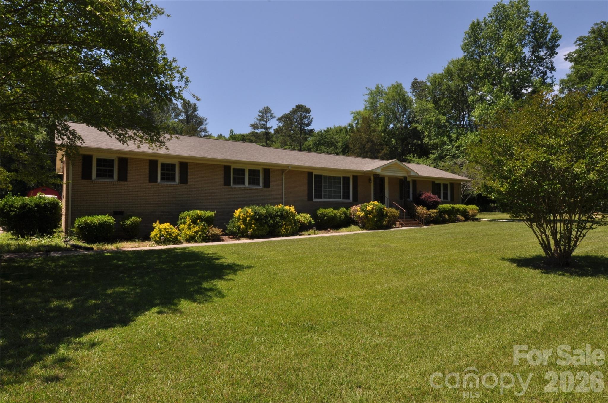 Welcome home to this beautifully maintained all-brick estate situated on 1.95 acres with county taxes only, while still being just minutes from town conveniences. Located in the growing community of Chester, this exceptional property offers the perfect combination of comfort, entertaining space, and private resort-style living with an easy commute to Charlotte or Columbia. Designed with family living in mind, this spacious home features 4 bedrooms and 2.5 baths with an abundance of storage throughout. The recently updated kitchen (2022) is truly the heart of the home, showcasing quartz countertops, custom wood cabinetry with soft-close doors and pull-out drawers, subway tile backsplash, recessed lighting, updated appliances, and a large eat-at bar with seating for four. A dedicated coffee bar area creates the perfect morning retreat. The oversized primary suite features separate his-and-her closets, while the luxurious primary bath includes custom cabinetry, double vanities, a linen closet, tile shower, and a soaking tub that has never been used. The hall bath offers double sinks and a walk-in shower, ideal for busy households.  Elegant formal living spaces include custom built-in cabinetry with recessed lighting, while the cozy den features shiplap ceilings, a fireplace, recessed lighting, and direct access to the backyard oasis. Outdoor living is where this property truly shines. Enjoy relaxing on the screened-in back porch with convenient access to the laundry room and half bath — perfectly positioned for pool guests so wet feet never track through the home. The inground pool is surrounded by an abundance of concrete decking with ample room for rockers, loungers, and outdoor entertaining. The expansive backyard offers endless possibilities for recreation, pets, and gatherings. Additional updates include: Roof replaced in 2023, Two HVAC units with scrubbers installed in 2018 & 2019, Pool pump replaced approximately 5 years ago

If you are looking for space, quality updates, privacy, and the perfect home for entertaining and everyday living, this property is a must-see.