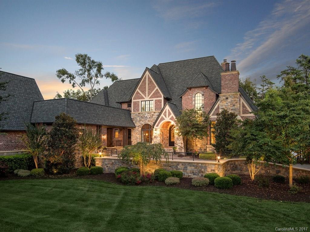 Custom brick & hand cut stone home w/wide open panoramic lake views. Open floor plan w/soaring ceilings extra tall doorways w/exquisite craftsmanship & moldings throughout. Gourmet kitchen open to two story GR with stone fireplace. Owner's & 2nd BR on main. Library w/FP & built in shelves. 2 BR & sitting/TV area up. LL with Rec room, Custom bar & wine room. Theater & Billiards. Exercise/office & 5th BR. Covered terraces & patio, grill, lake half bath.4 car garage. Private pier Room for pool.
